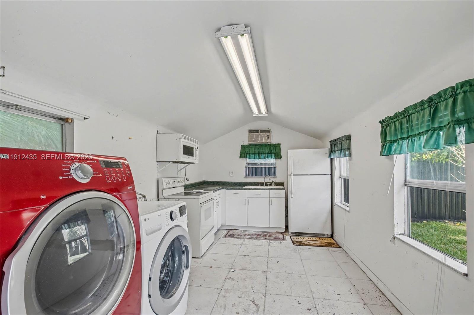 5936 Southwest 29th Street Miami, FL 33155 - Photo 28 of 32 a utility room with dryer and washer