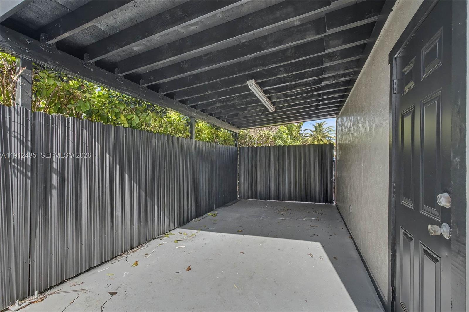 5936 Southwest 29th Street Miami, FL 33155 - Photo 29 of 32 a view of a shaded area of wooden fence