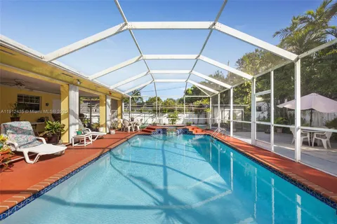 a room with lots of potted plants