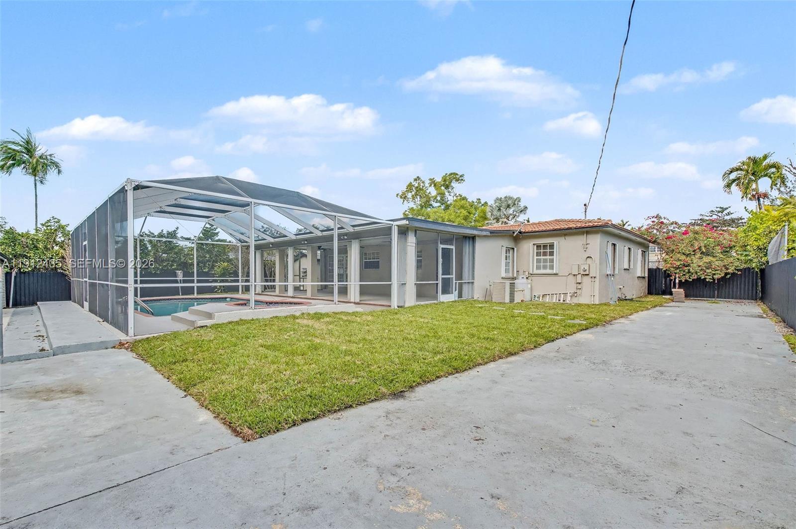 5936 Southwest 29th Street Miami, FL 33155 - Photo 32 of 32 a view of a house with a backyard and windows