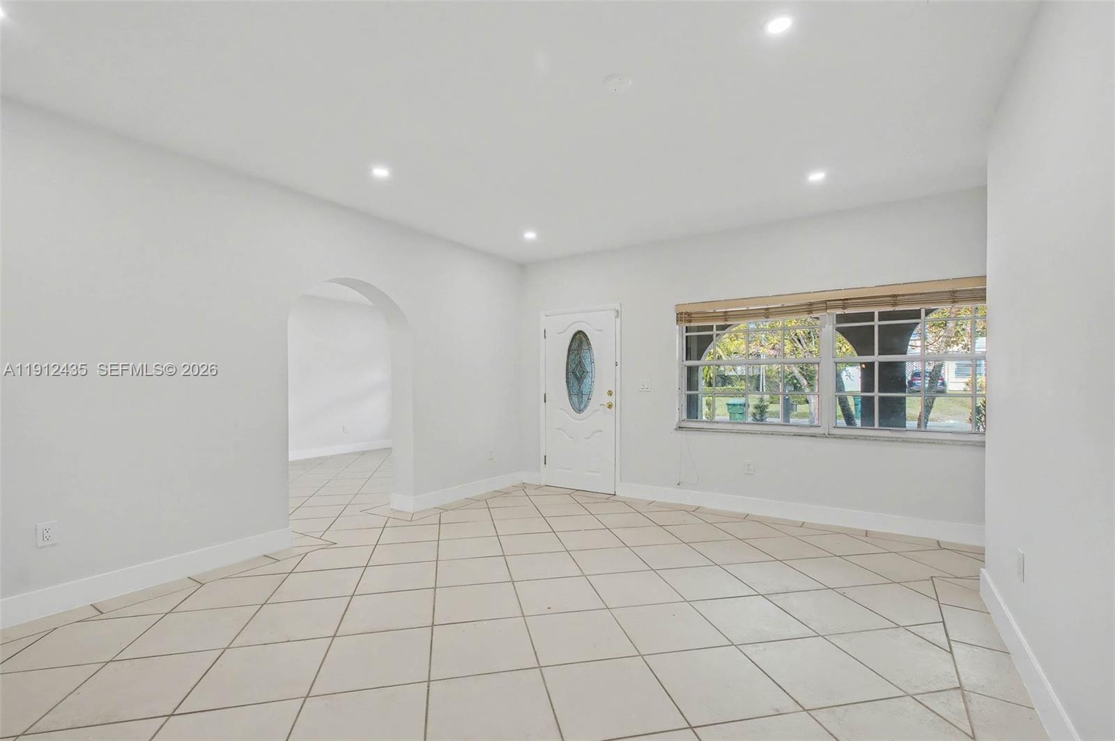 5936 Southwest 29th Street Miami, FL 33155 - Photo 4 of 32 a view of an empty room and window