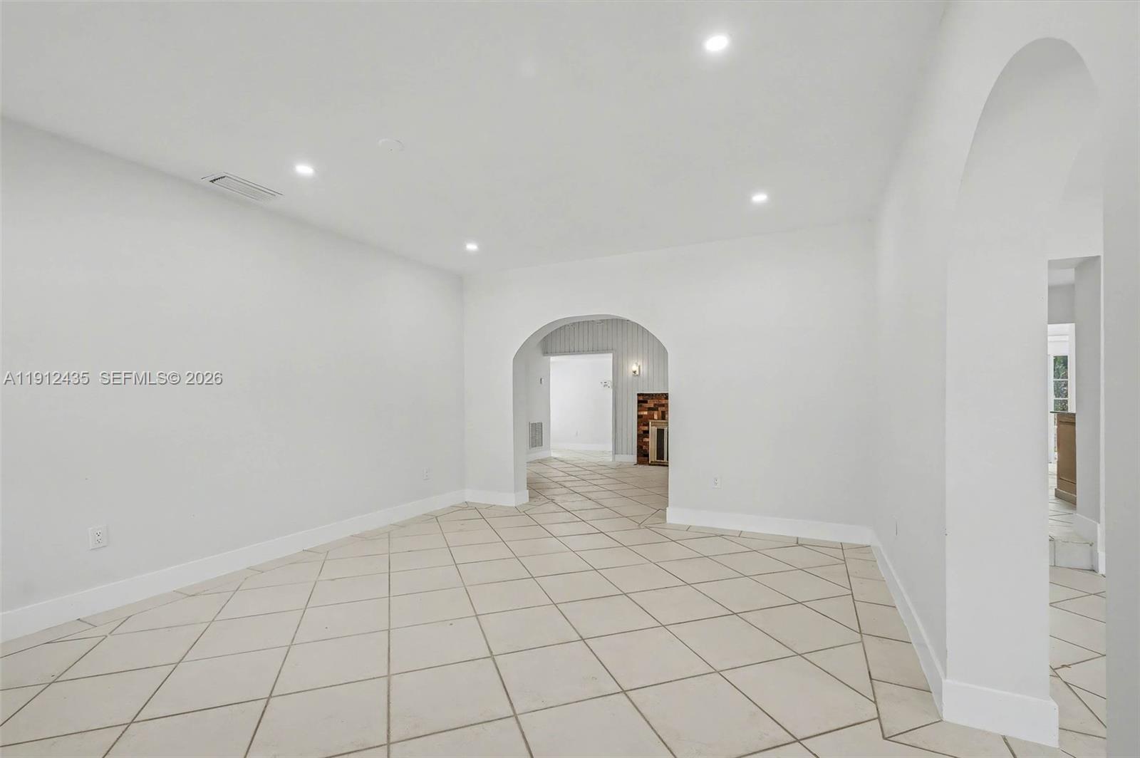 5936 Southwest 29th Street Miami, FL 33155 - Photo 5 of 32 a view of an empty room with a window