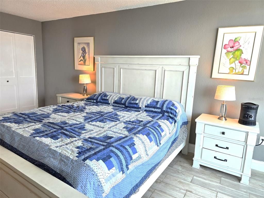 17408 Gulf Boulevard, Unit 1003 Redington Shores, FL 33708 - Photo 19 of 28 a bedroom with a bed and a window