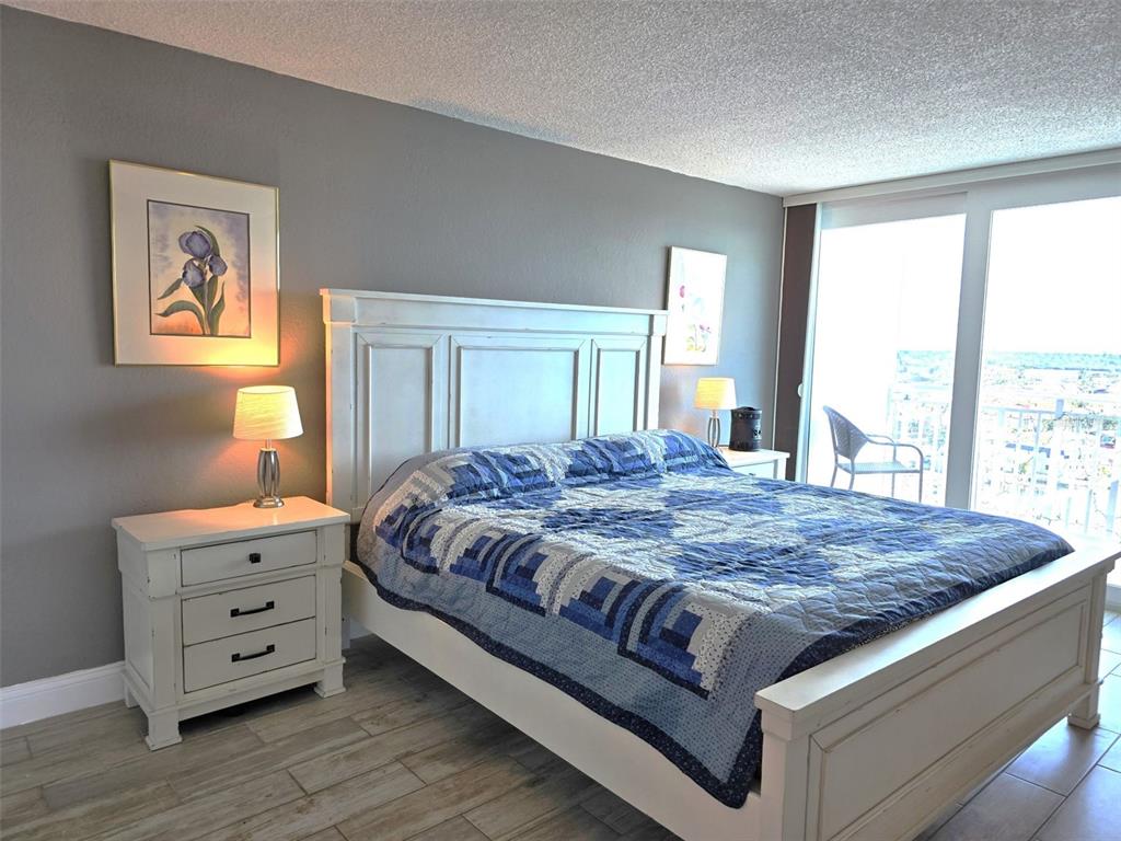 17408 Gulf Boulevard, Unit 1003 Redington Shores, FL 33708 - Photo 20 of 28 a bedroom with a bed and window
