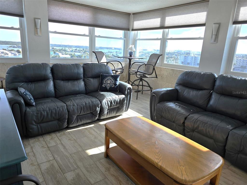 17408 Gulf Boulevard, Unit 1003 Redington Shores, FL 33708 - Photo 6 of 28 a living room with furniture and a large window