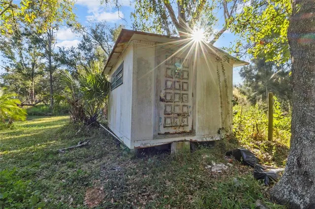 a view of backyard with garden and deck