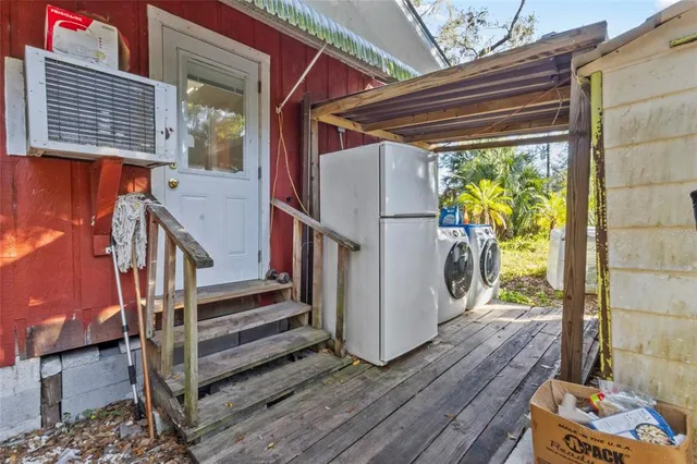 a view of entryway with wooden floor