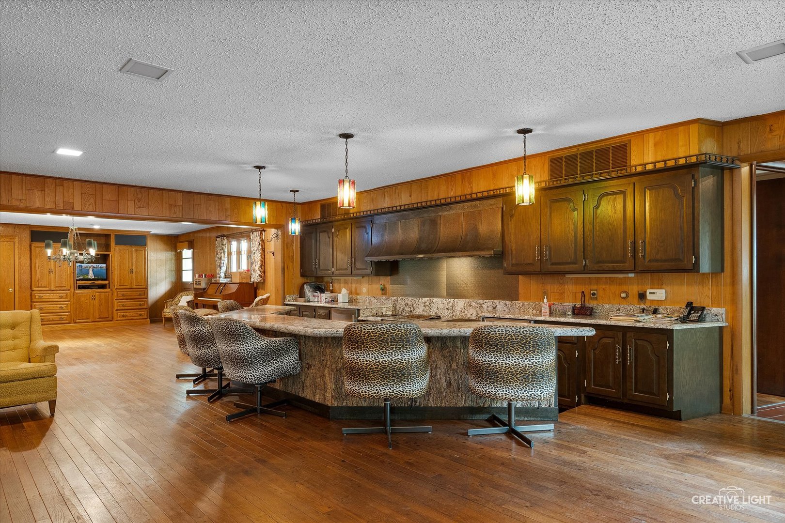 16323 Griswold Springs Road Plano, IL 60545 - Photo 7 of 55 a living room with lots of furniture and kitchen view