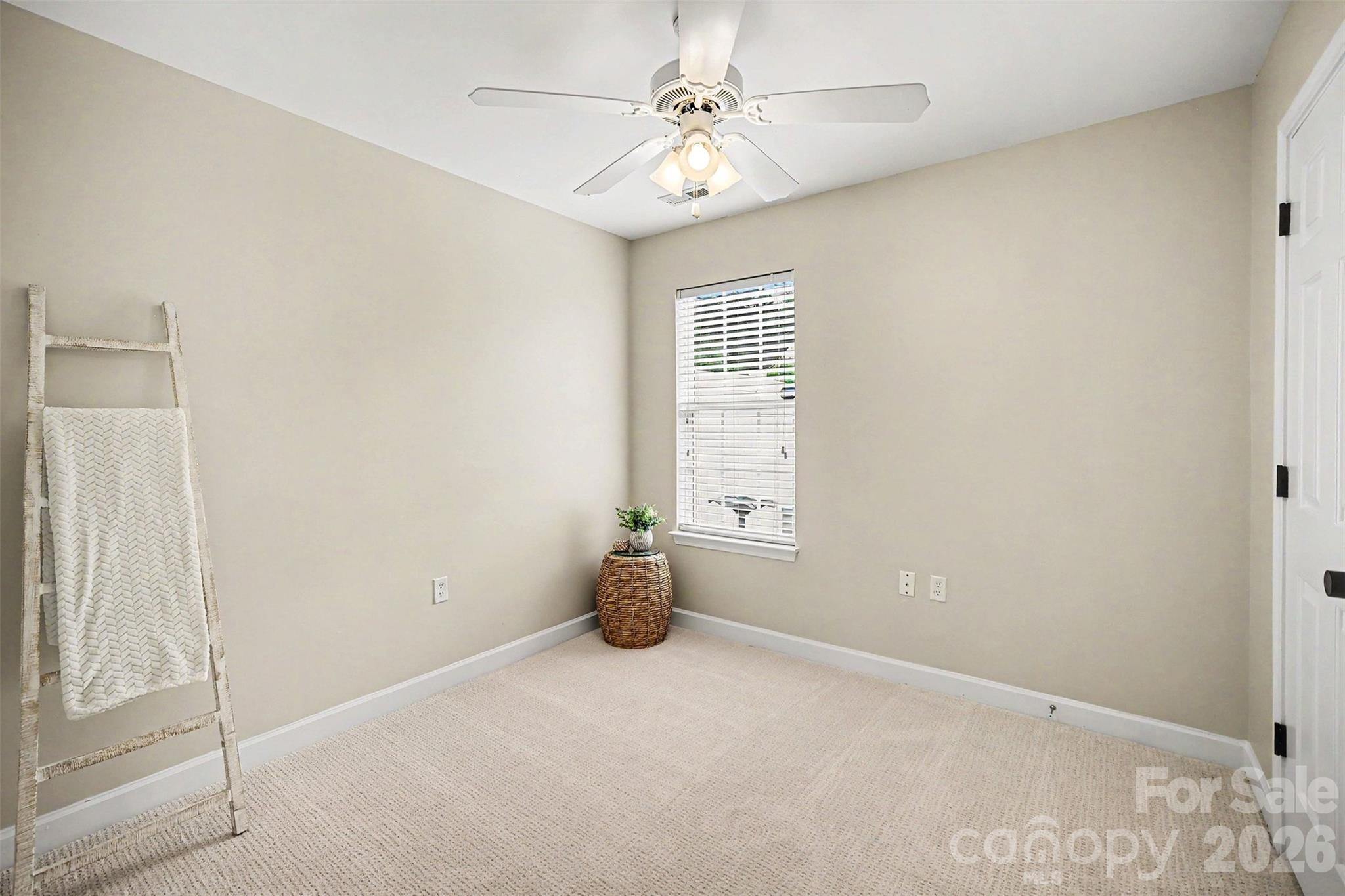 1210 Sheldon Brook Lane Fort Mill, SC 29707 - Photo 18 of 26 an empty room with windows and fan