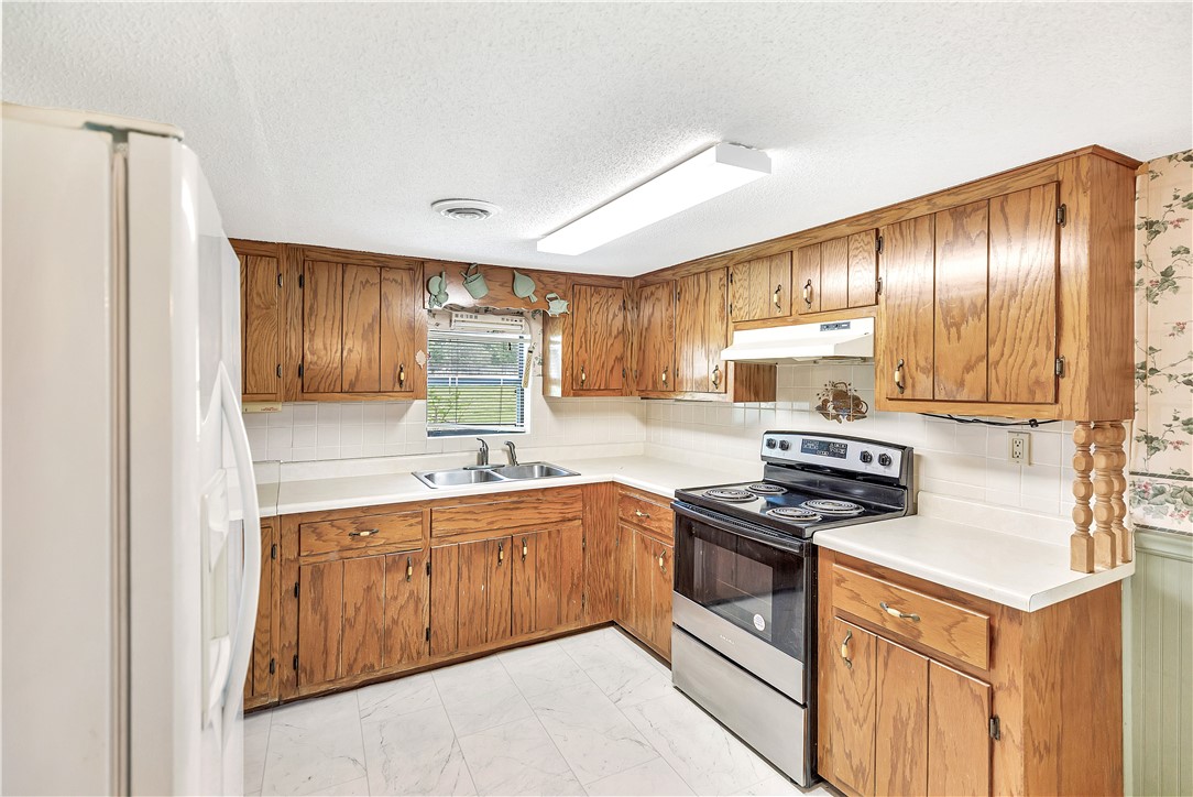 1004 Wiles Road Anderson, SC 29625 - Photo 12 of 26 Functional kitchen with ample cabinetry and easy-to-maintain surfaces.