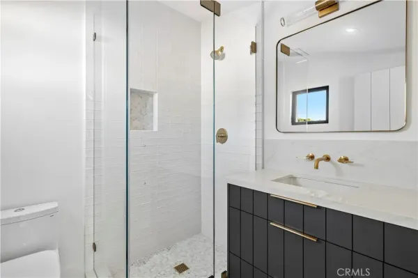 a bathroom with a sink and mirror