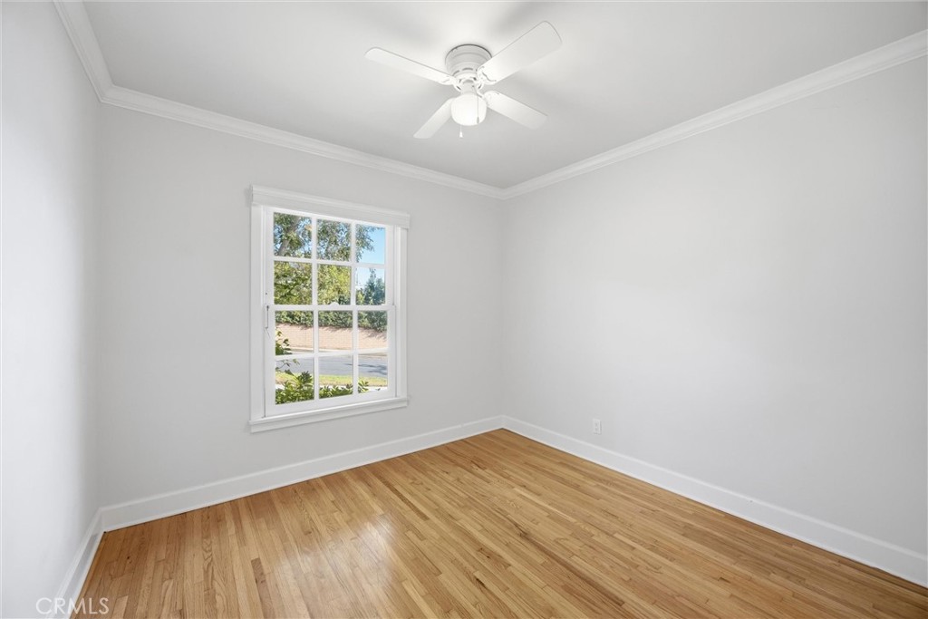 3513 May Street Los Angeles, CA 90066 - Photo 18 of 34 an empty room with a window and a chandelier fan