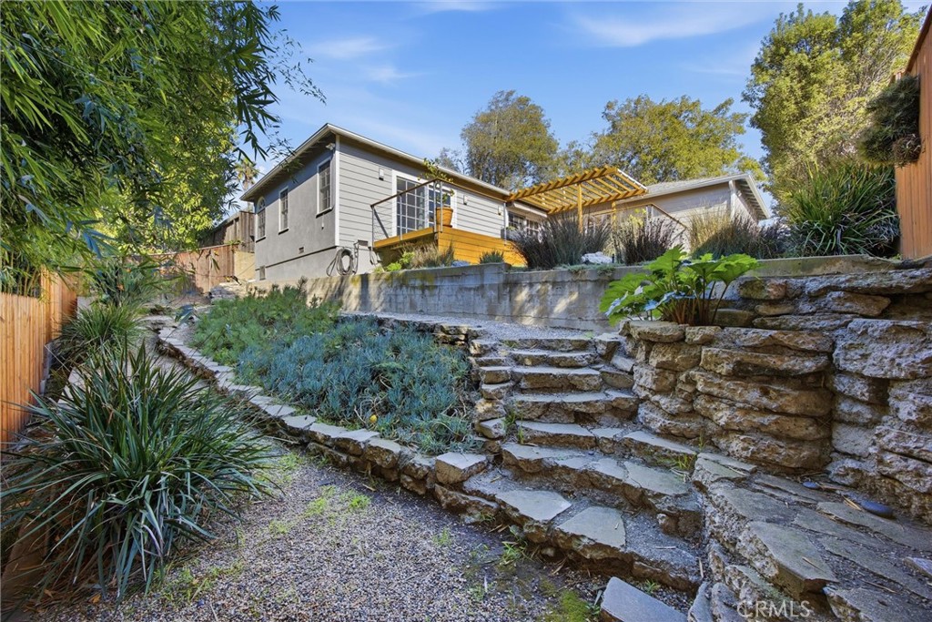3513 May Street Los Angeles, CA 90066 - Photo 29 of 34 a front view of a house with a yard and potted plants