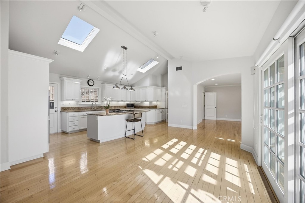 3513 May Street Los Angeles, CA 90066 - Photo 7 of 34 a large white kitchen with lots of counter top space and stainless steel appliances