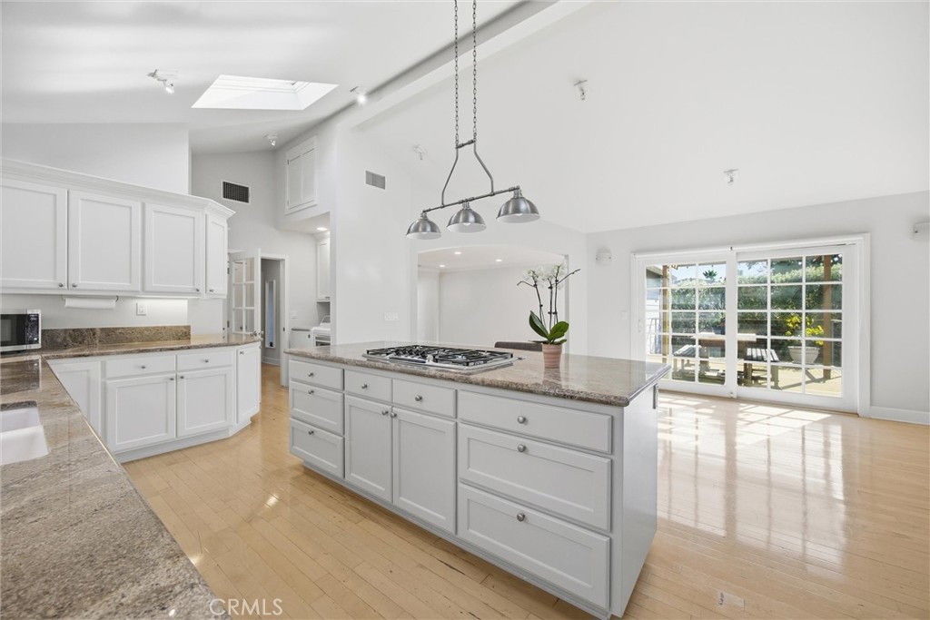 3513 May Street Los Angeles, CA 90066 - Photo 9 of 34 a large kitchen with kitchen island granite countertop a sink a window and stainless steel appliances