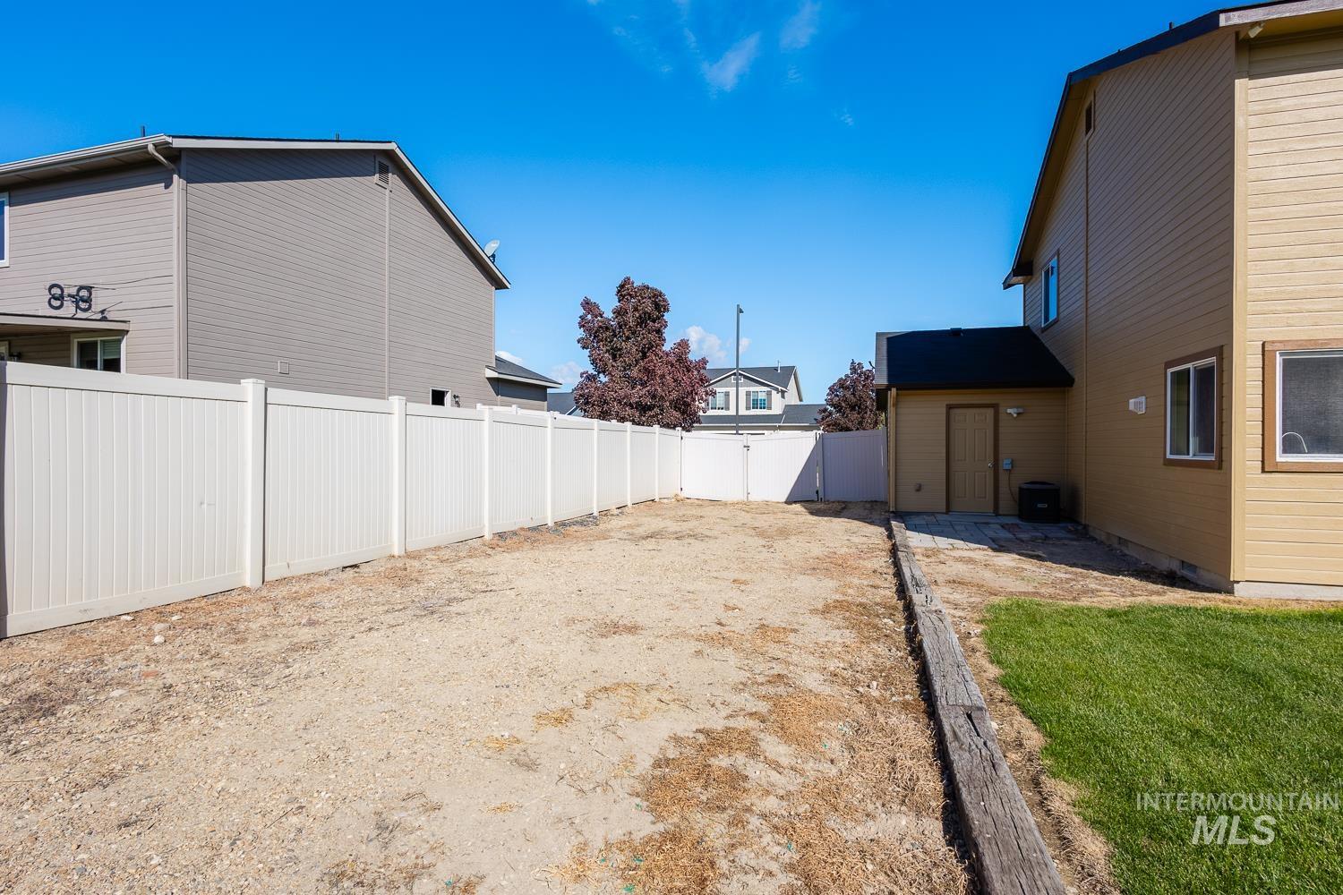 14253 Moreno Drive Caldwell, ID 83607 - Photo 40 of 48 Expansive gravel area with a white privacy fence