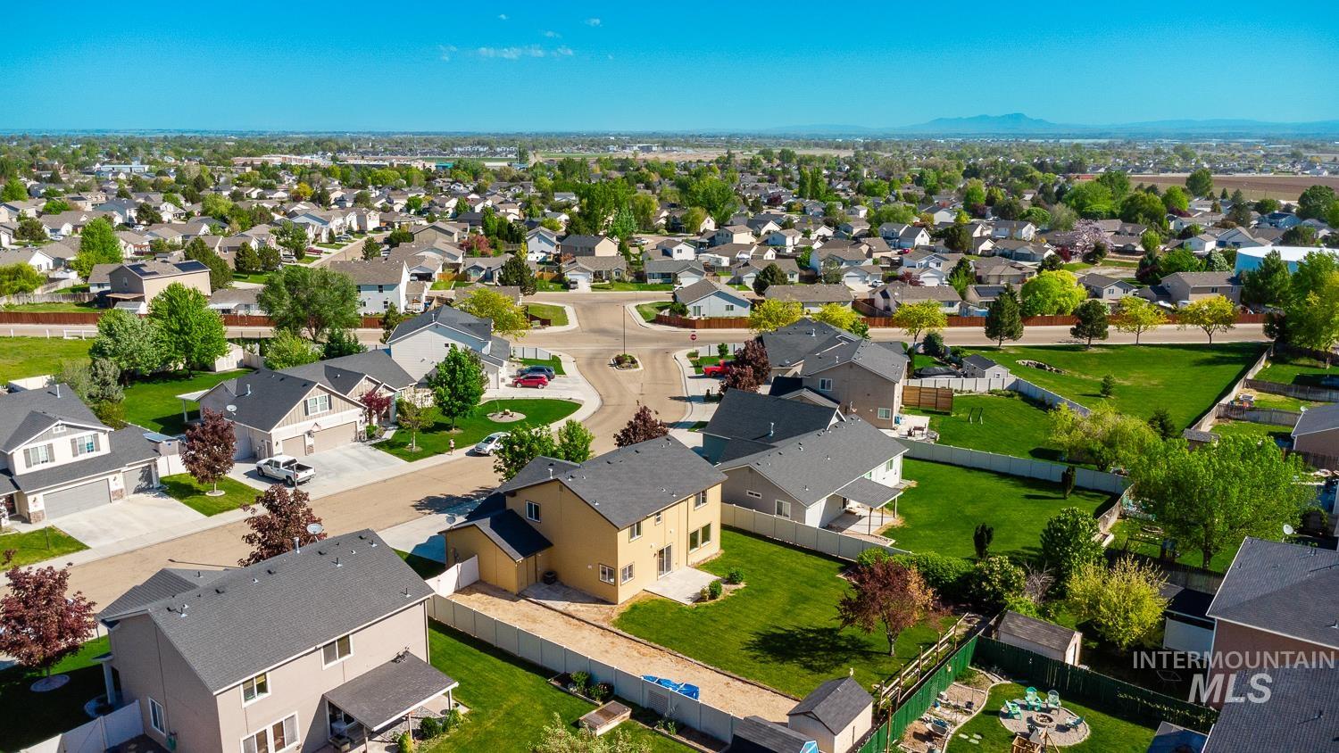 14253 Moreno Drive Caldwell, ID 83607 - Photo 47 of 48 Residential neighborhood with a mix of single-family homes, mature trees, and landscaped yards