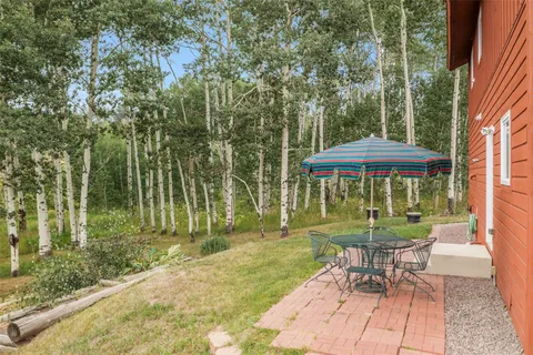 a view of a table and chairs in the patio