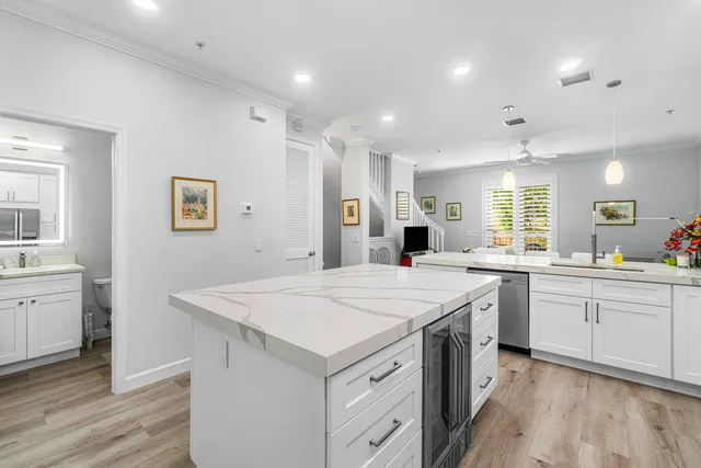 a bathroom with a granite countertop toilet sink and mirror