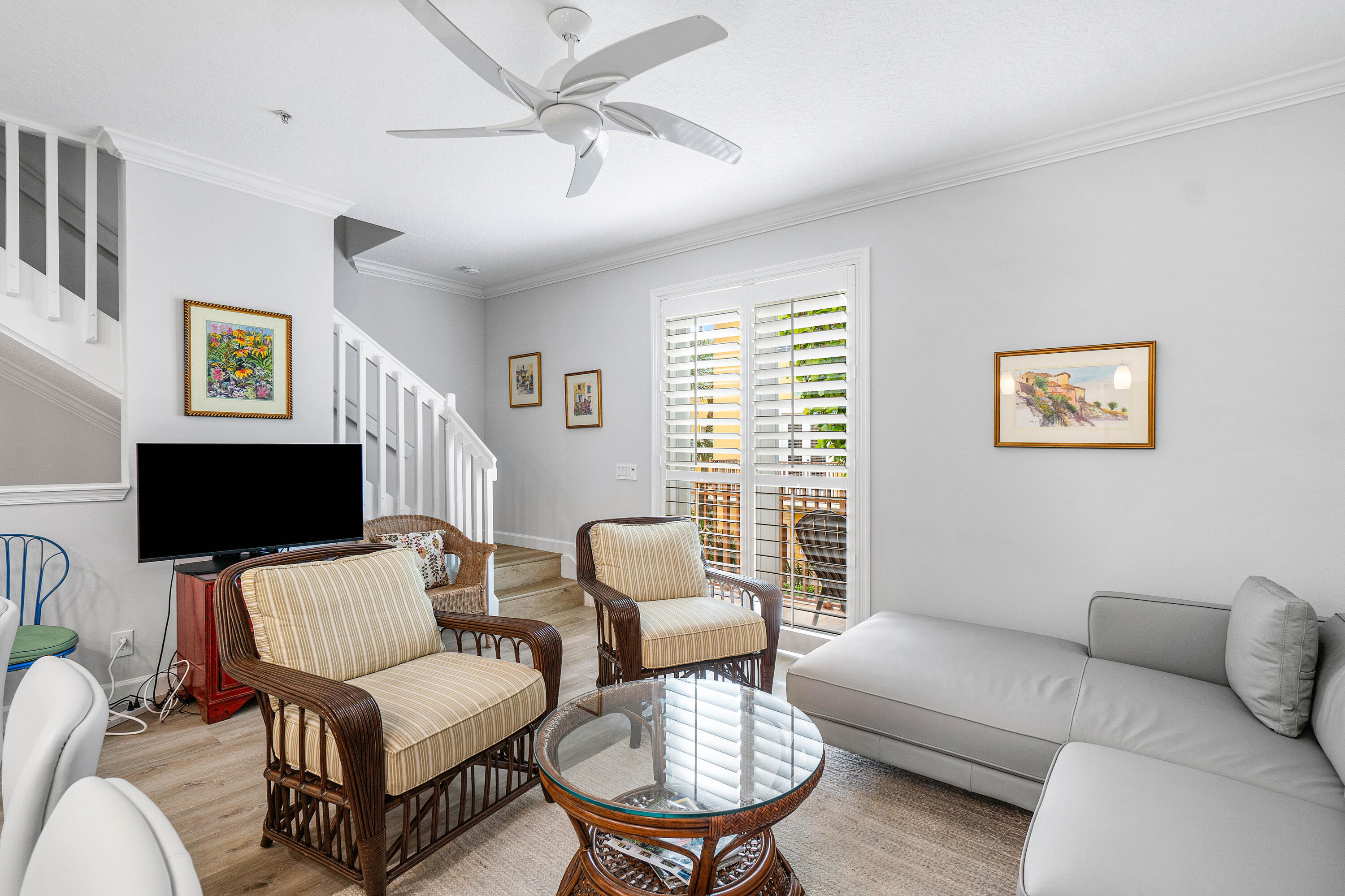 65 Southeast 5th Avenue, Unit B Delray Beach, FL 33483 - Photo 17 of 47 a living room with furniture a flat screen tv and a window