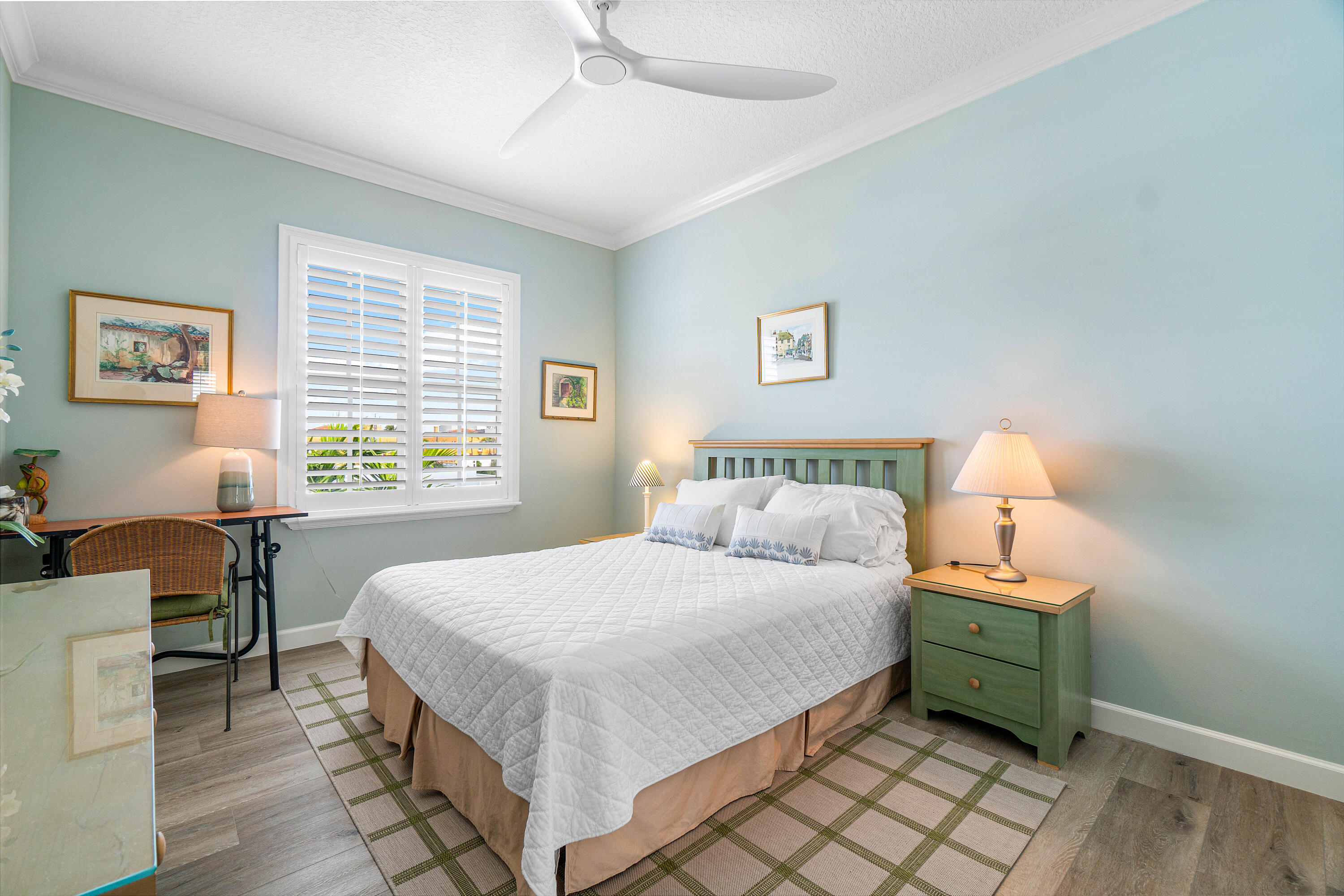 65 Southeast 5th Avenue, Unit B Delray Beach, FL 33483 - Photo 21 of 47 a bedroom with a bed and a window