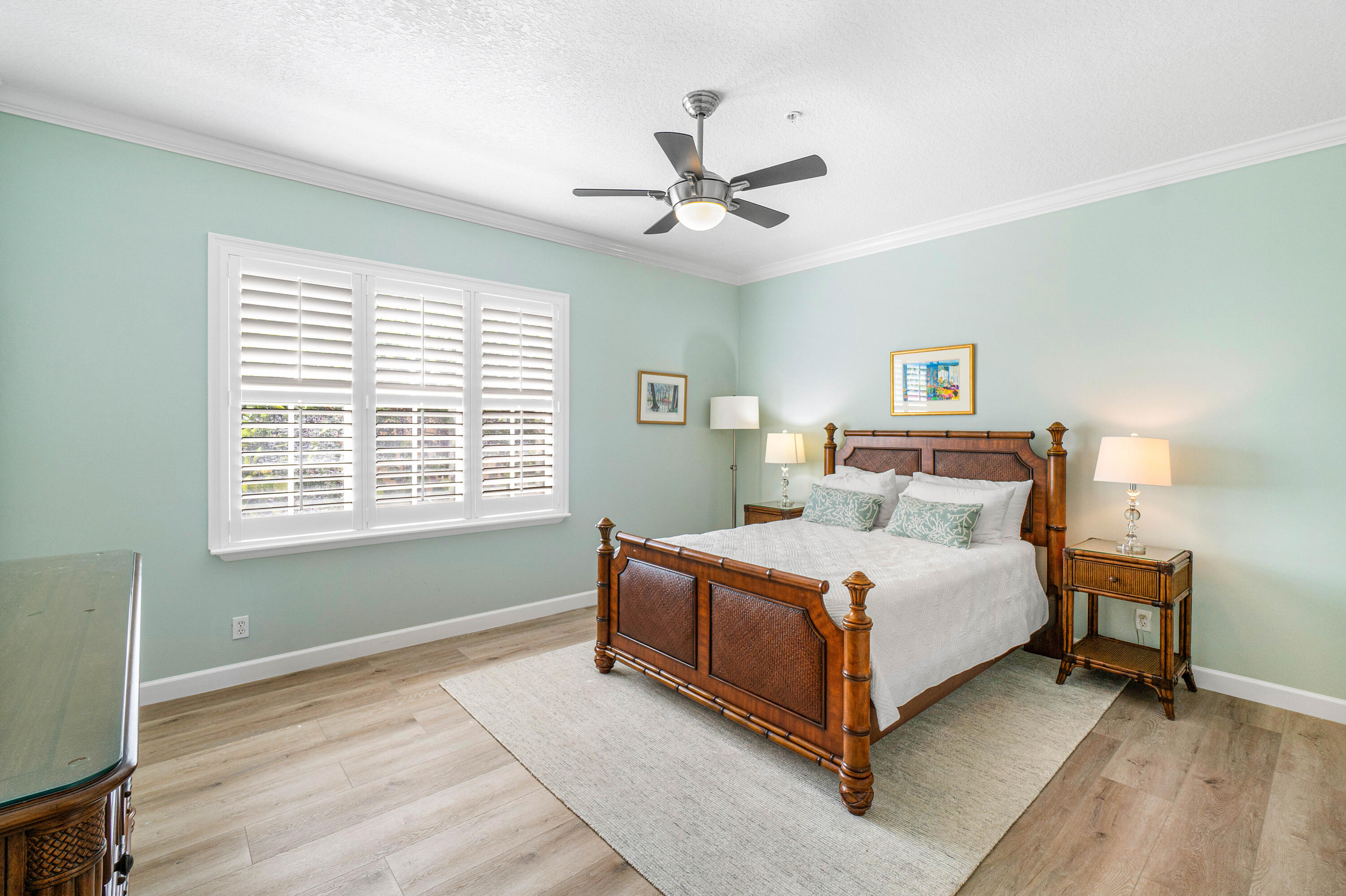 65 Southeast 5th Avenue, Unit B Delray Beach, FL 33483 - Photo 23 of 47 a bedroom with a bed lamp and a window