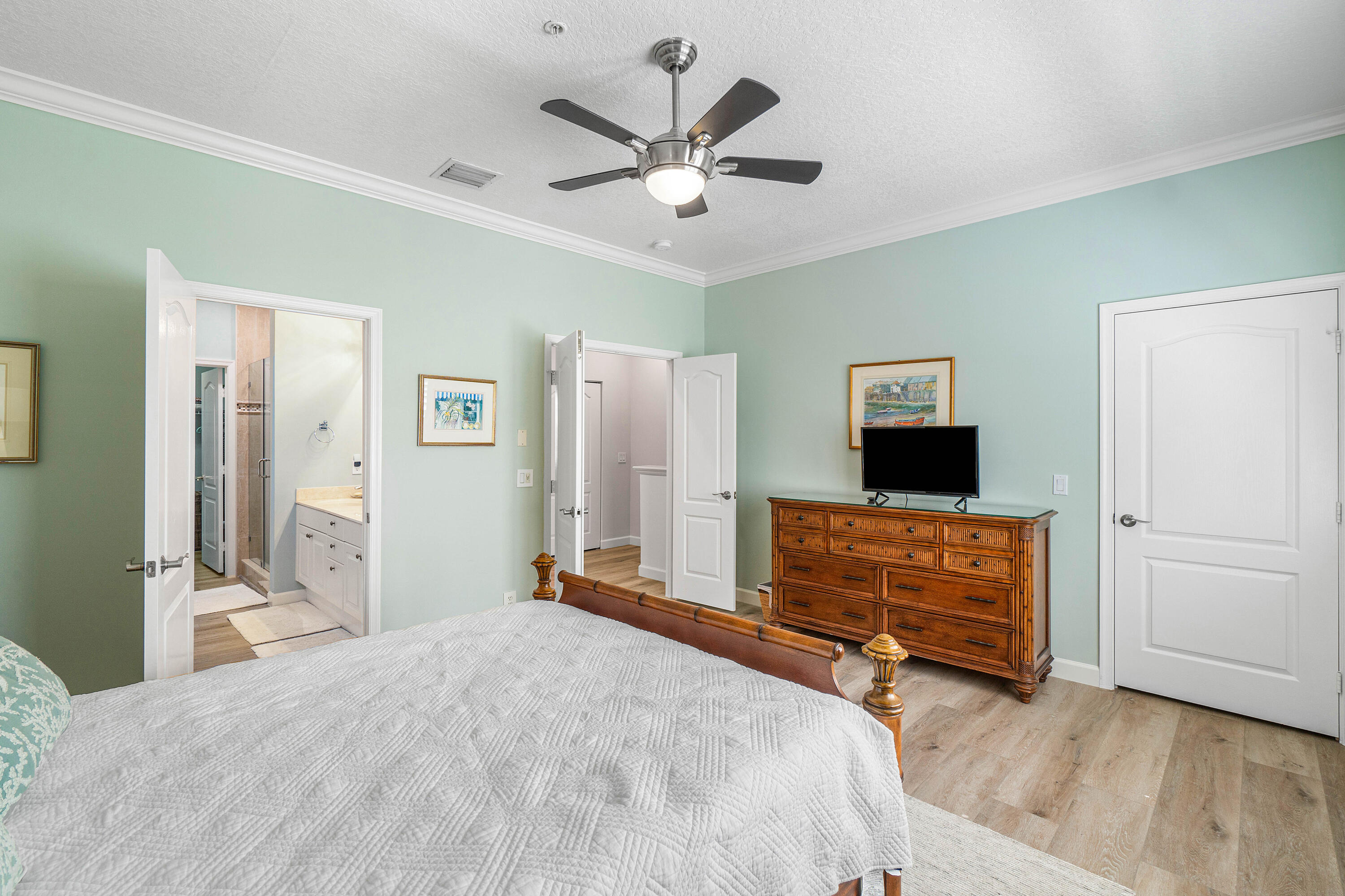 65 Southeast 5th Avenue, Unit B Delray Beach, FL 33483 - Photo 24 of 47 a bedroom with a bed and a flat screen tv