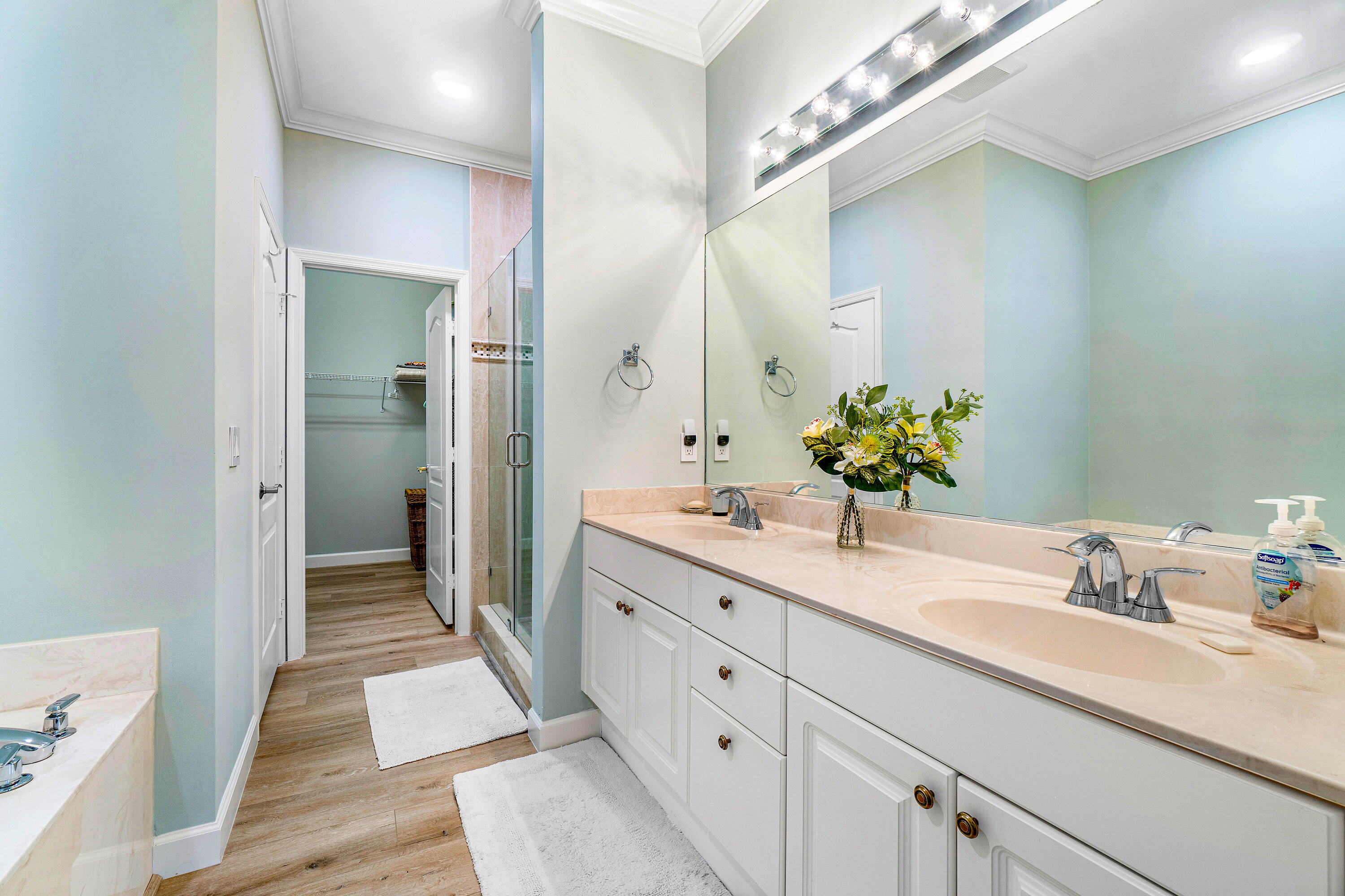 65 Southeast 5th Avenue, Unit B Delray Beach, FL 33483 - Photo 25 of 47 a bathroom with a double vanity sink and a mirror