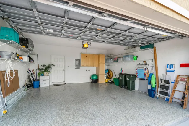 an aerial view of a house with a yard and outdoor seating