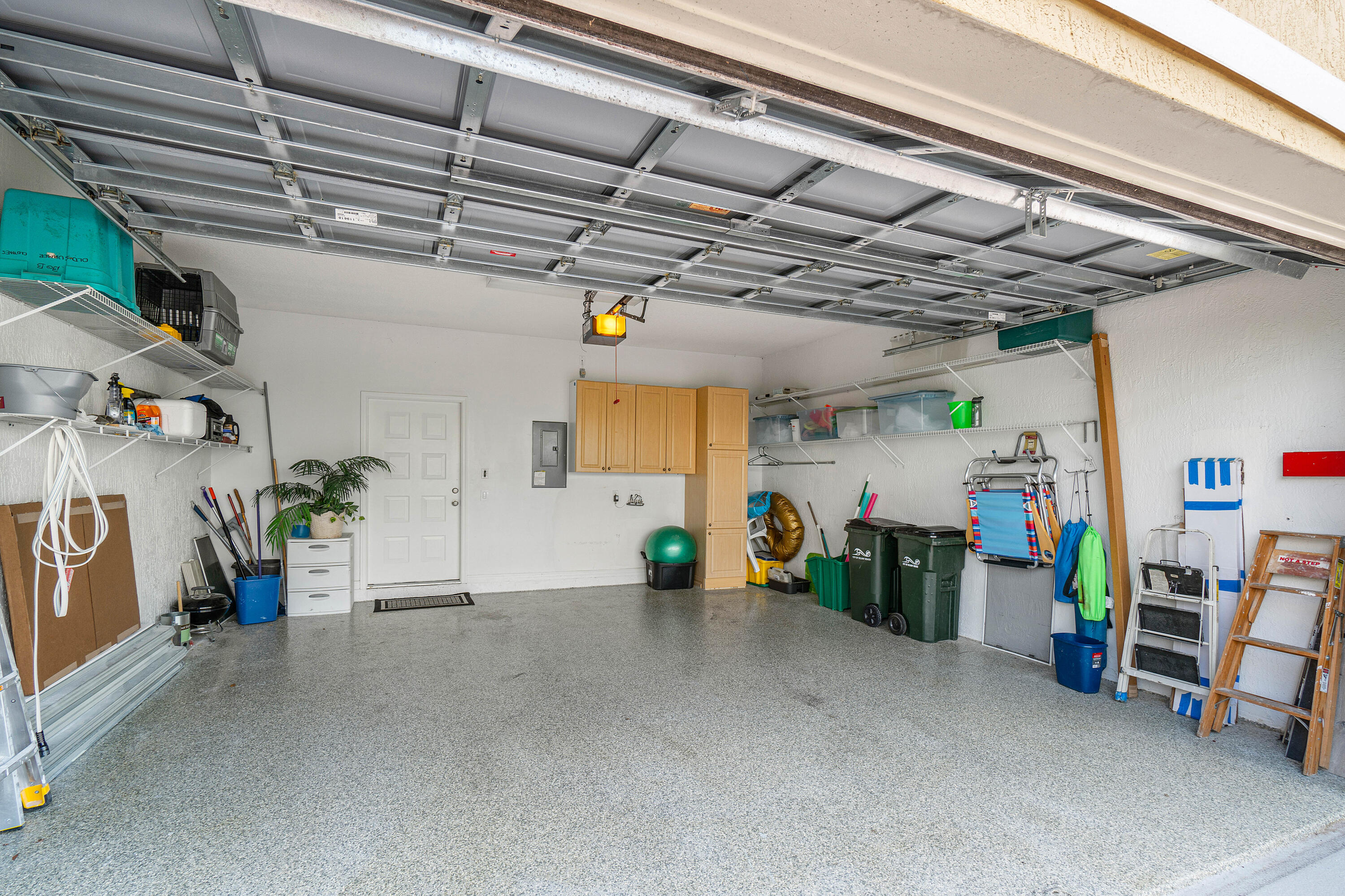 65 Southeast 5th Avenue, Unit B Delray Beach, FL 33483 - Photo 30 of 47 a view of a garage with furniture