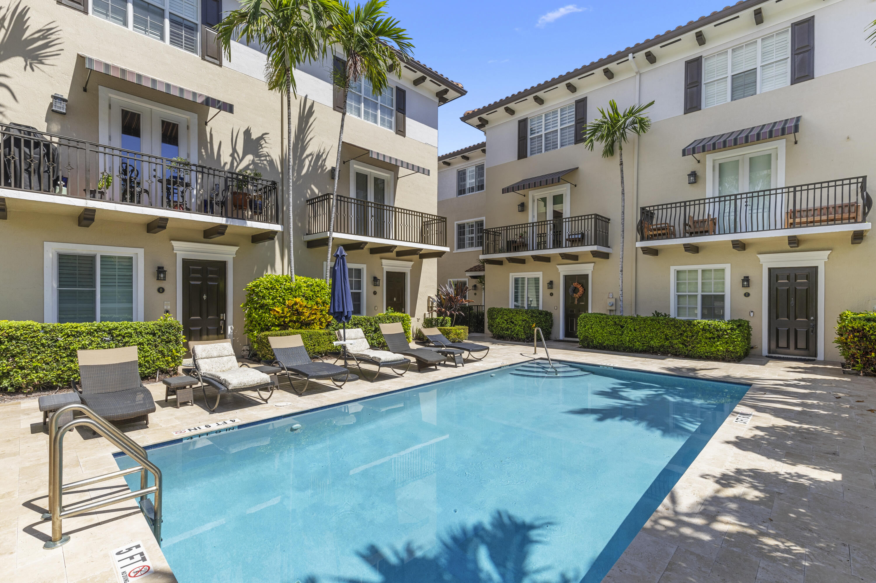 65 Southeast 5th Avenue, Unit B Delray Beach, FL 33483 - Photo 37 of 47 a view of a building with garden and sitting area