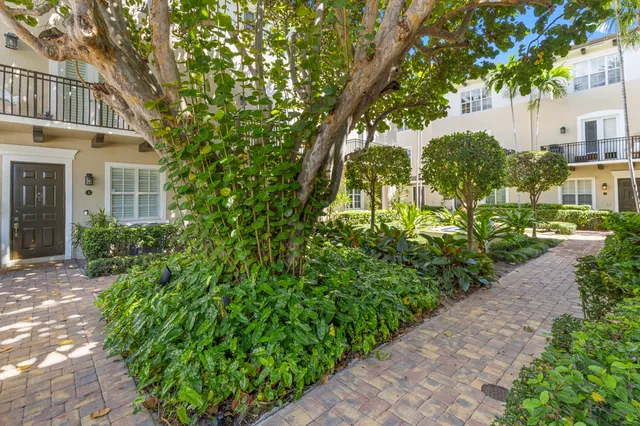 a kitchen with kitchen island a sink table and chairs