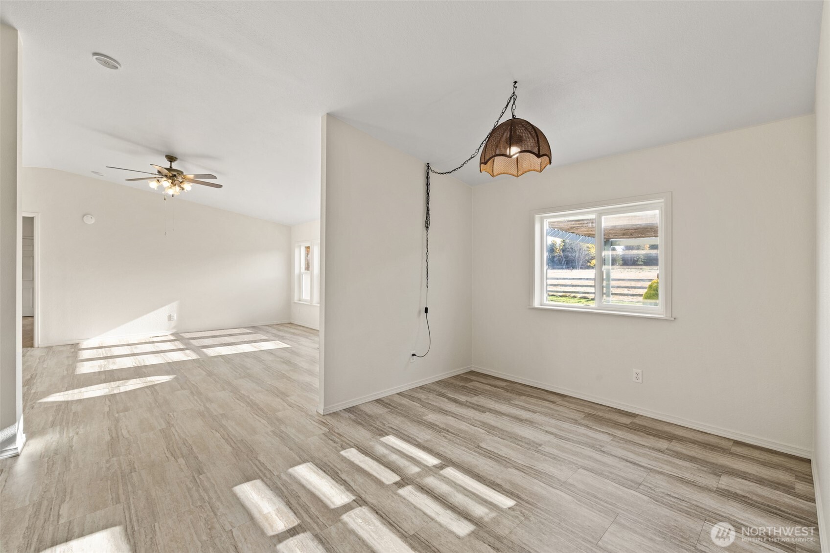 132 Cosmos Lane Port Angeles, WA 98362 - Photo 12 of 40 wooden floor in an empty room with a window