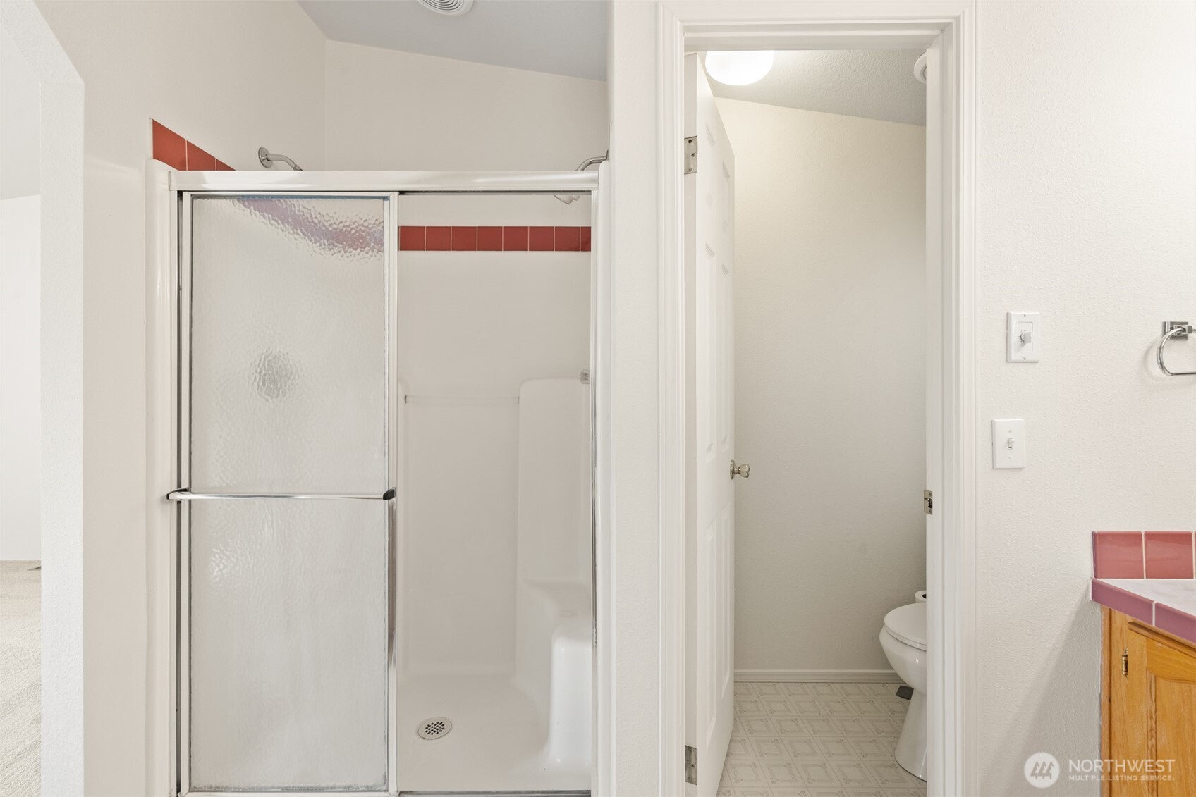 132 Cosmos Lane Port Angeles, WA 98362 - Photo 27 of 40 a bathroom with a shower and a toilet