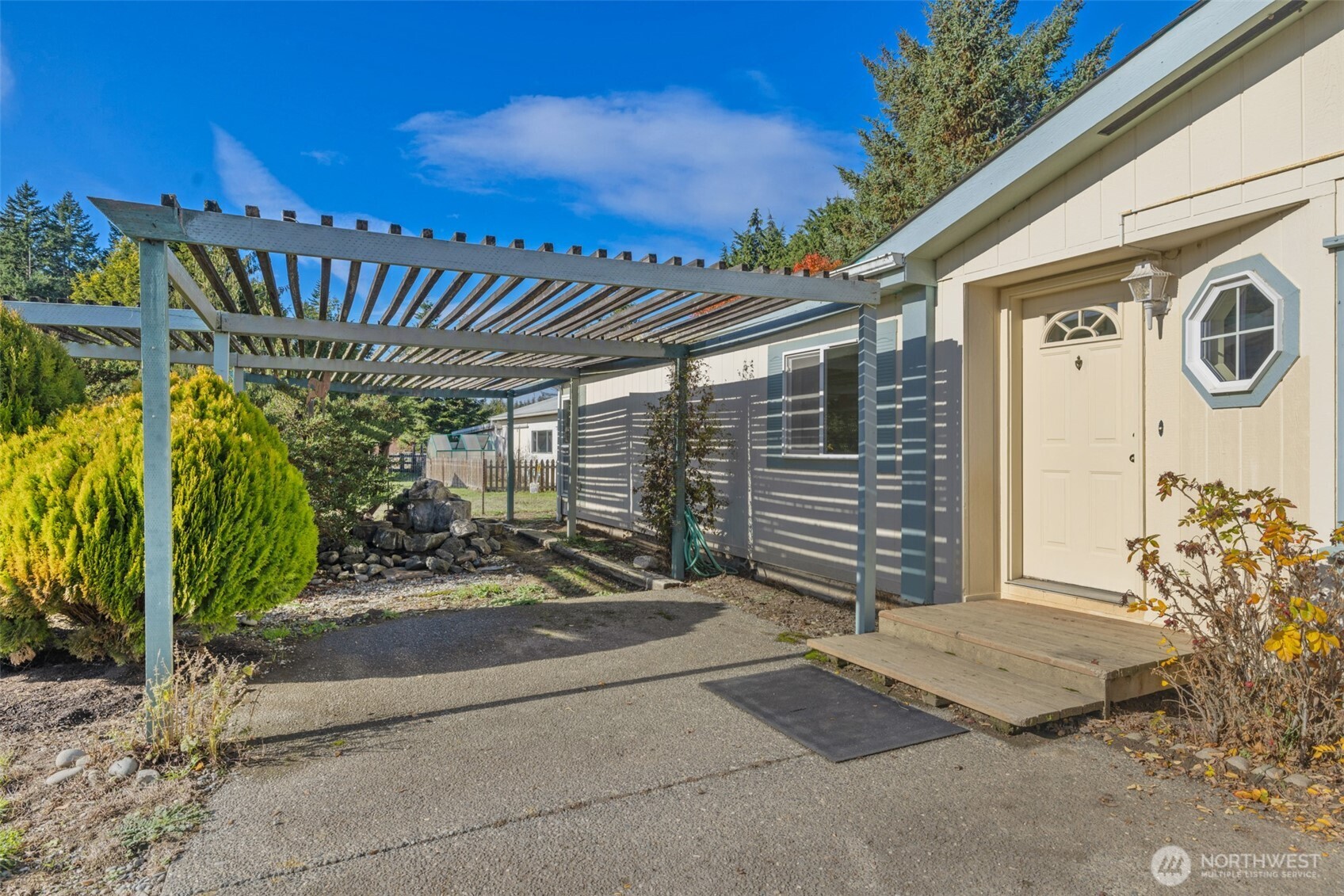 132 Cosmos Lane Port Angeles, WA 98362 - Photo 29 of 40 a front view of a house with garden
