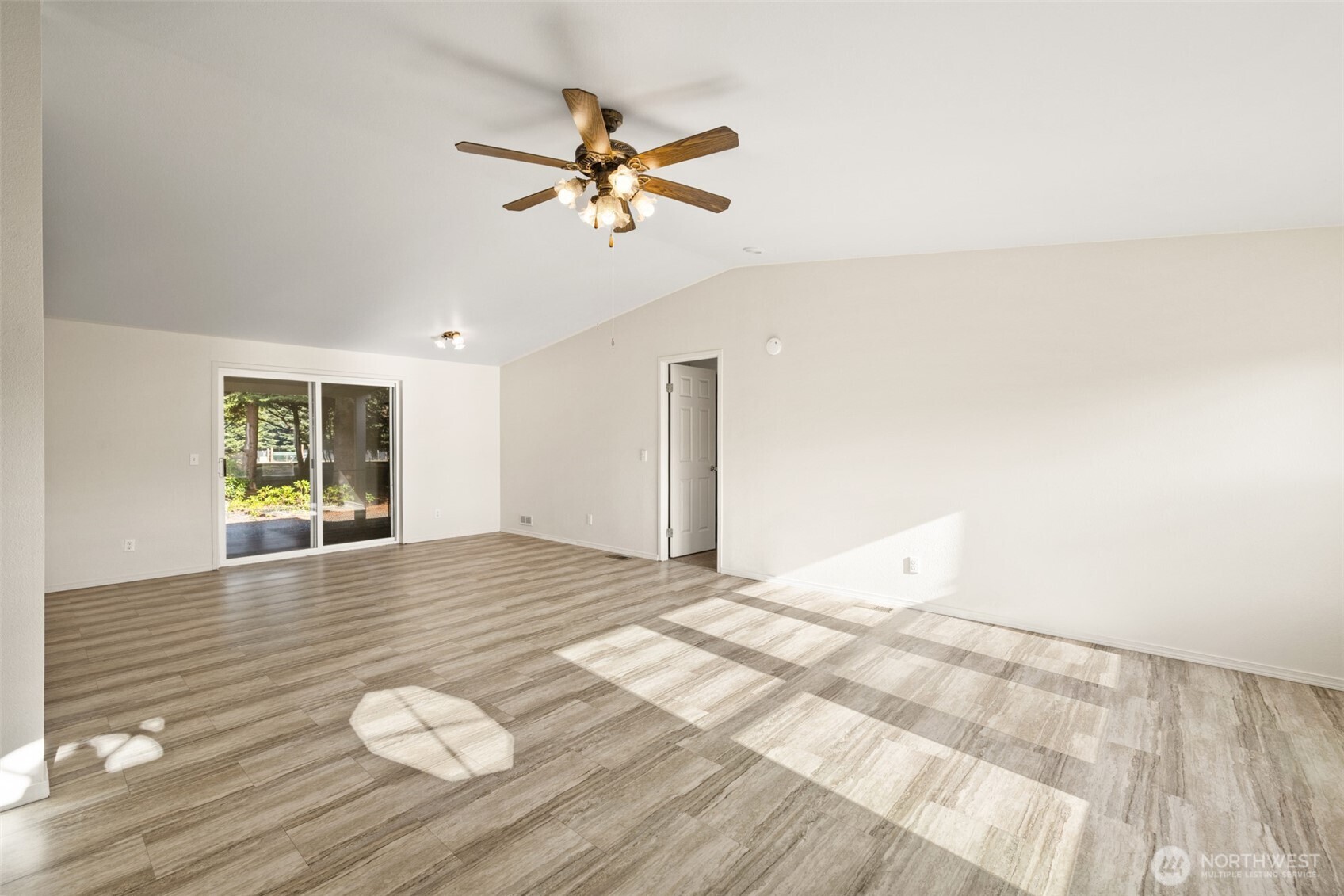 132 Cosmos Lane Port Angeles, WA 98362 - Photo 9 of 40 a view of empty room with wooden floor and fan