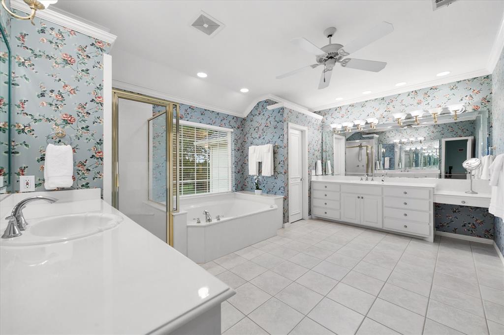 506 Meadowview Road Heath, TX 75032 - Photo 19 of 32 a large white bathroom with a large tub sink vanity granite and a shower