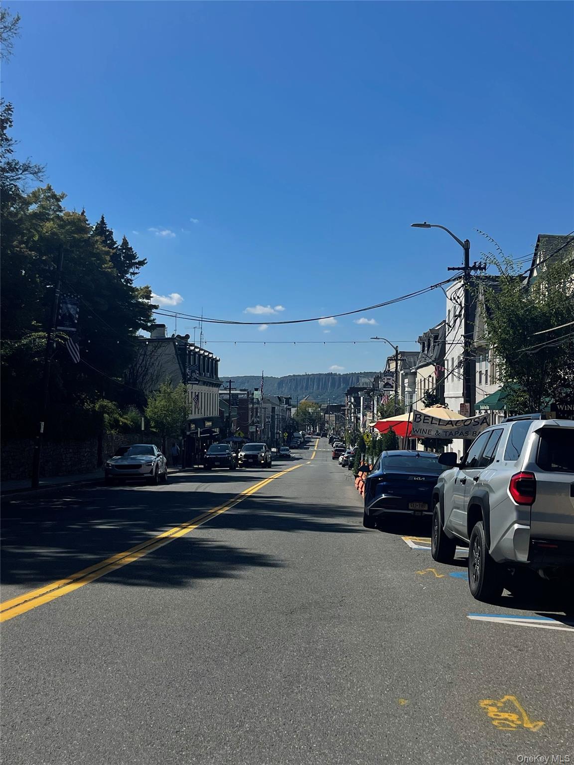 100 Cedar Street, Unit A21 Dobbs Ferry, NY 10522 - Photo 12 of 12 View of asphalt road with street lighting, sidewalks, and curbs