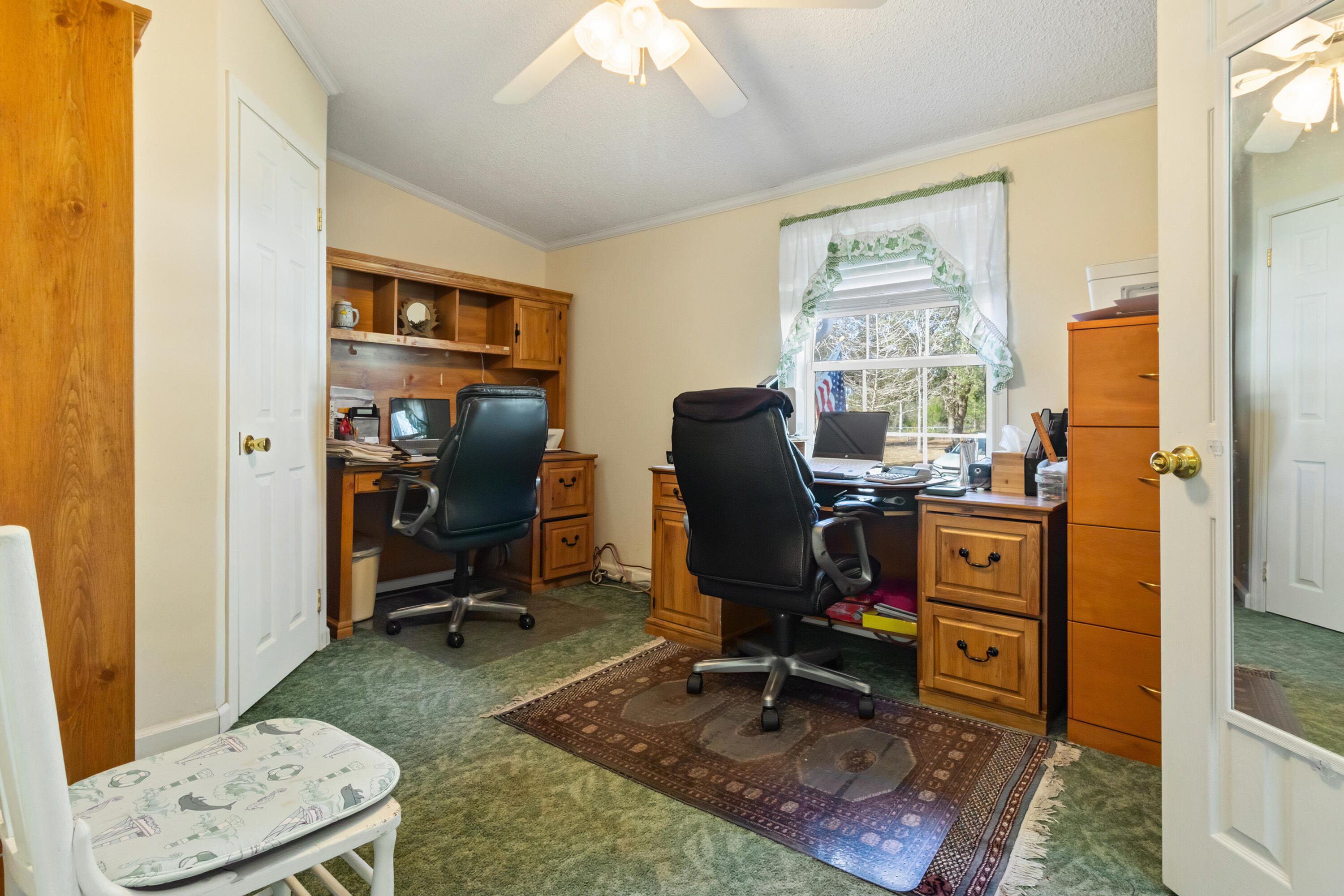 387 Pope Street Freeport, FL 32439 - Photo 18 of 82 a view of a workspace with furniture and a window