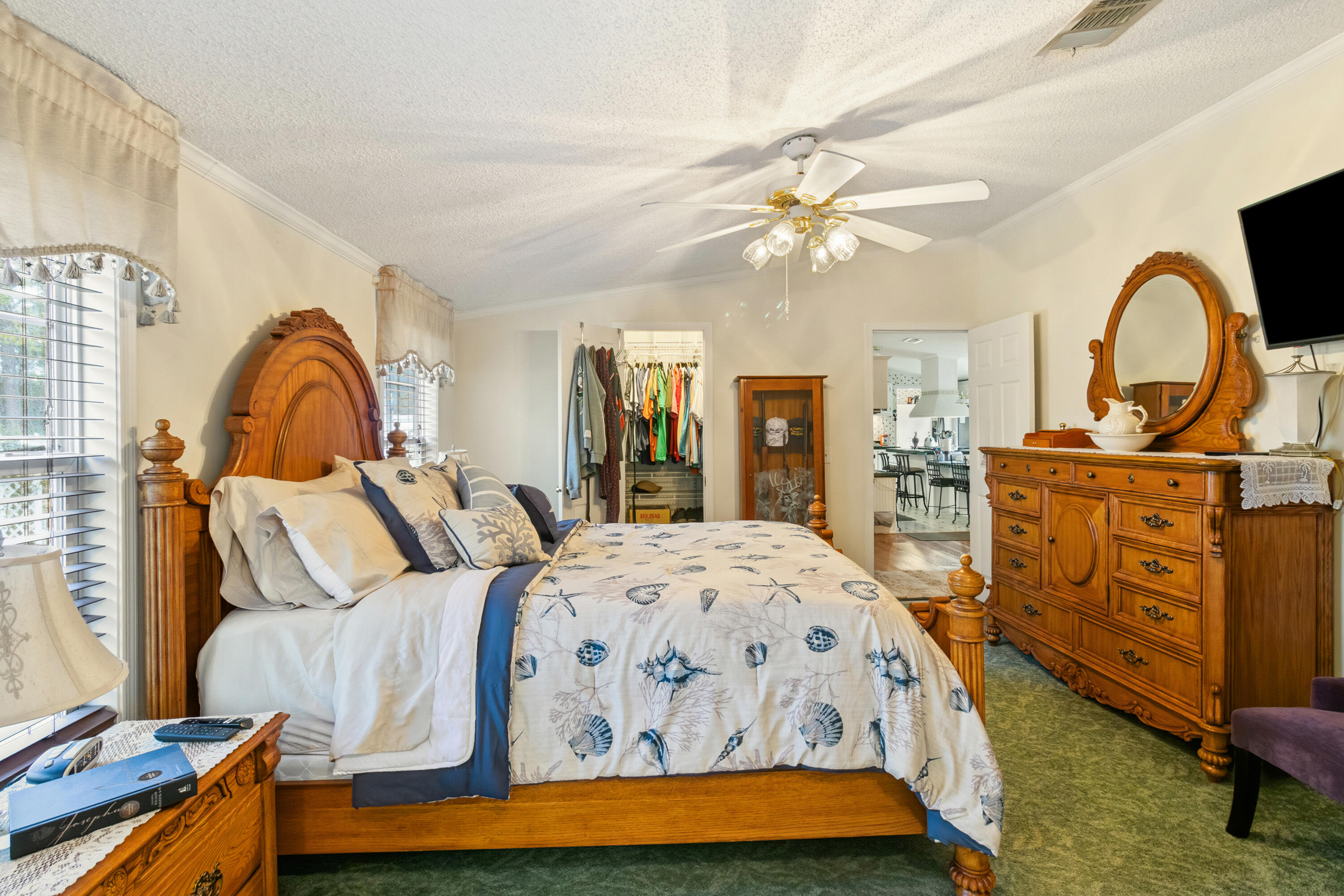 387 Pope Street Freeport, FL 32439 - Photo 27 of 82 a bedroom with a bed and a dresser