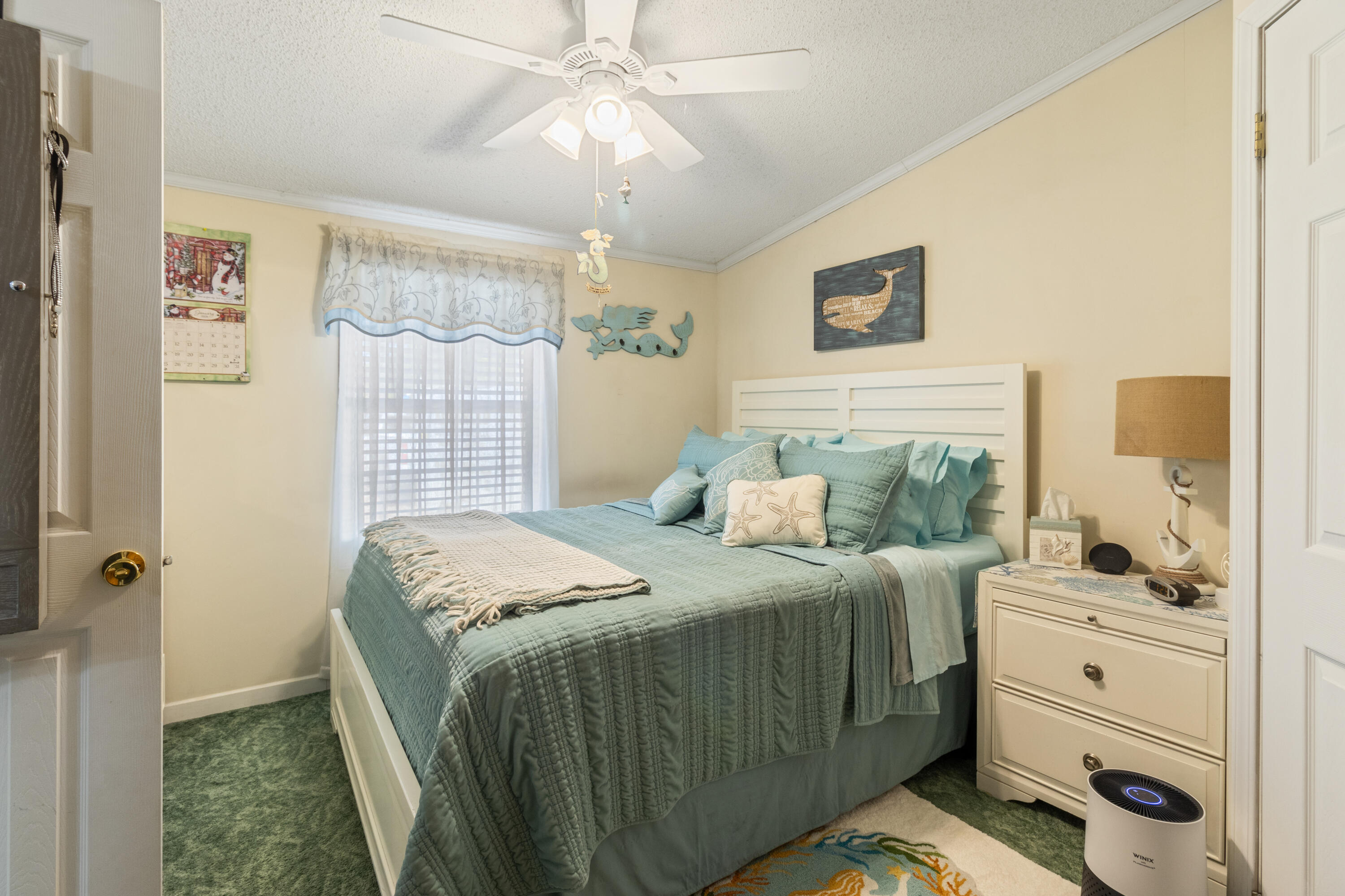 387 Pope Street Freeport, FL 32439 - Photo 33 of 82 a bedroom with a bed and a window