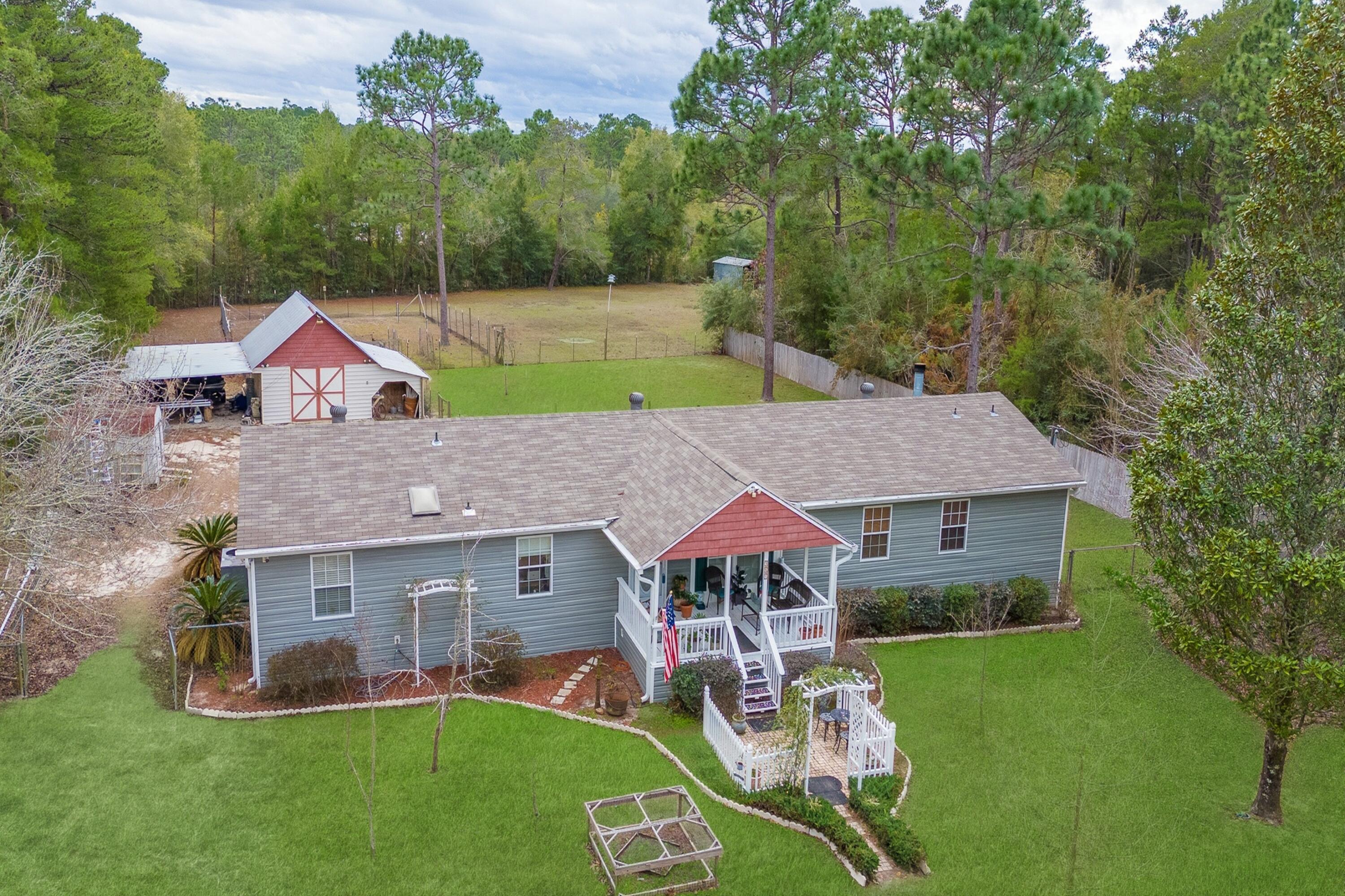 387 Pope Street Freeport, FL 32439 - Photo 4 of 82 Front photo is edited to enhance lawn to