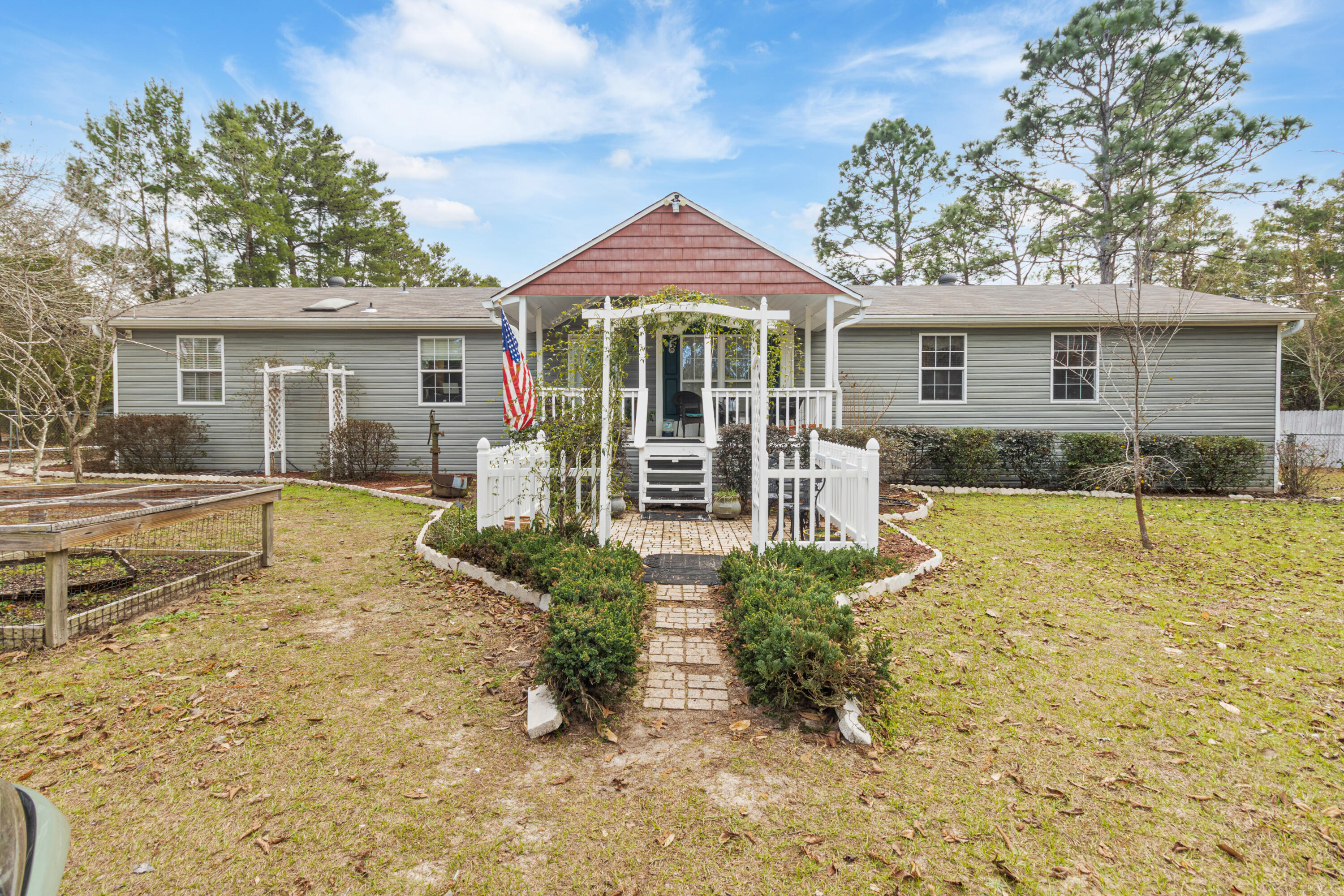 387 Pope Street Freeport, FL 32439 - Photo 43 of 82 front view of a house with a yard