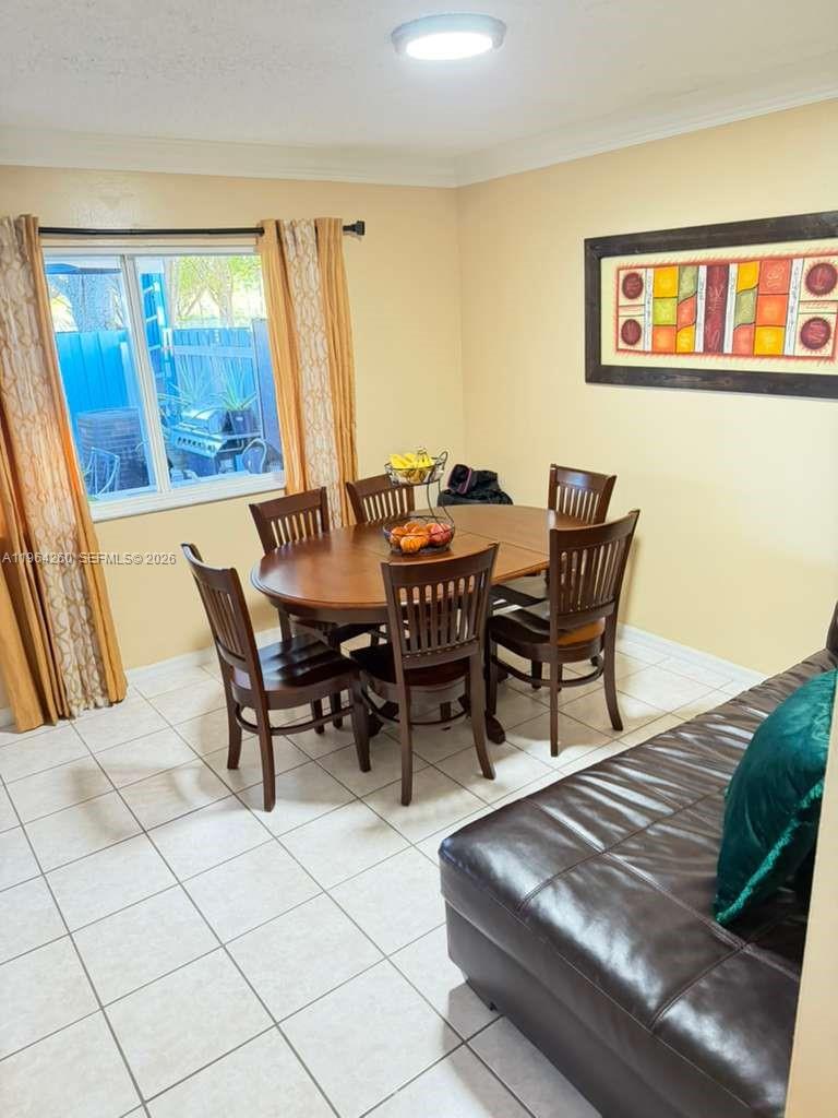 14012 Southwest 179th Street Miami, FL 33177 - Photo 12 of 17 a view of a dining room with furniture and window