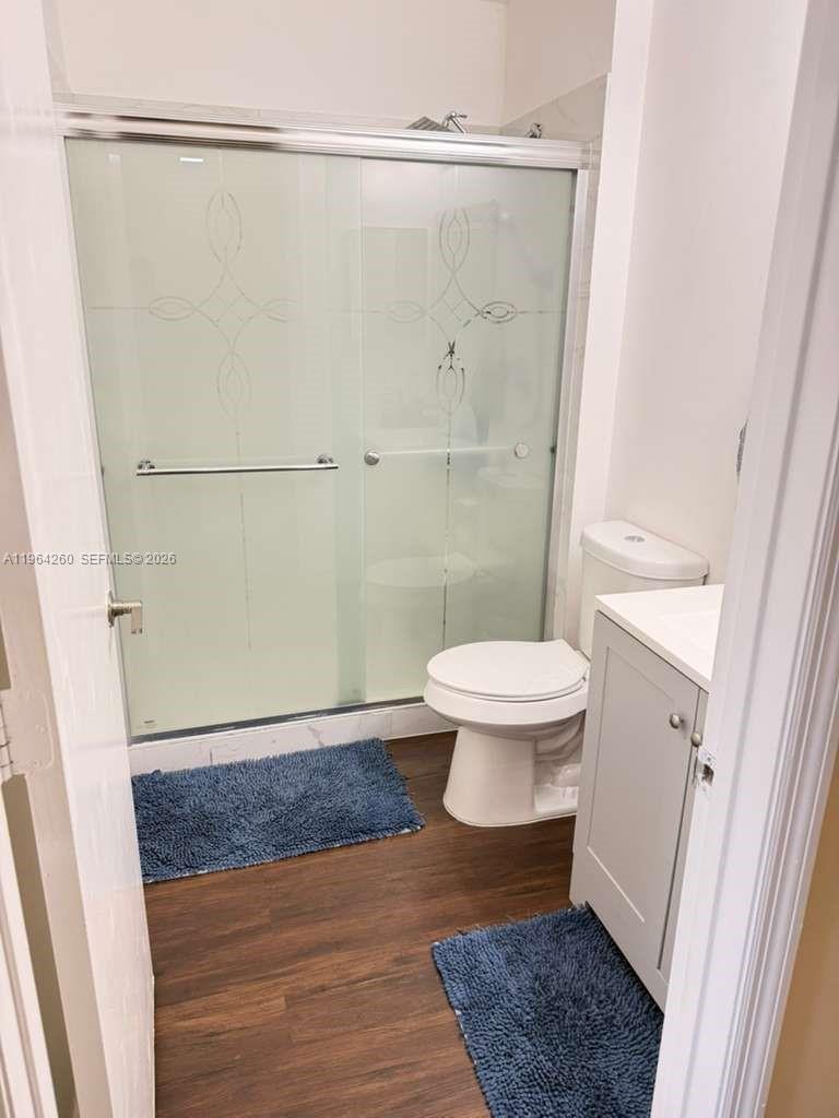 14012 Southwest 179th Street Miami, FL 33177 - Photo 16 of 17 a bathroom with a toilet and a shower