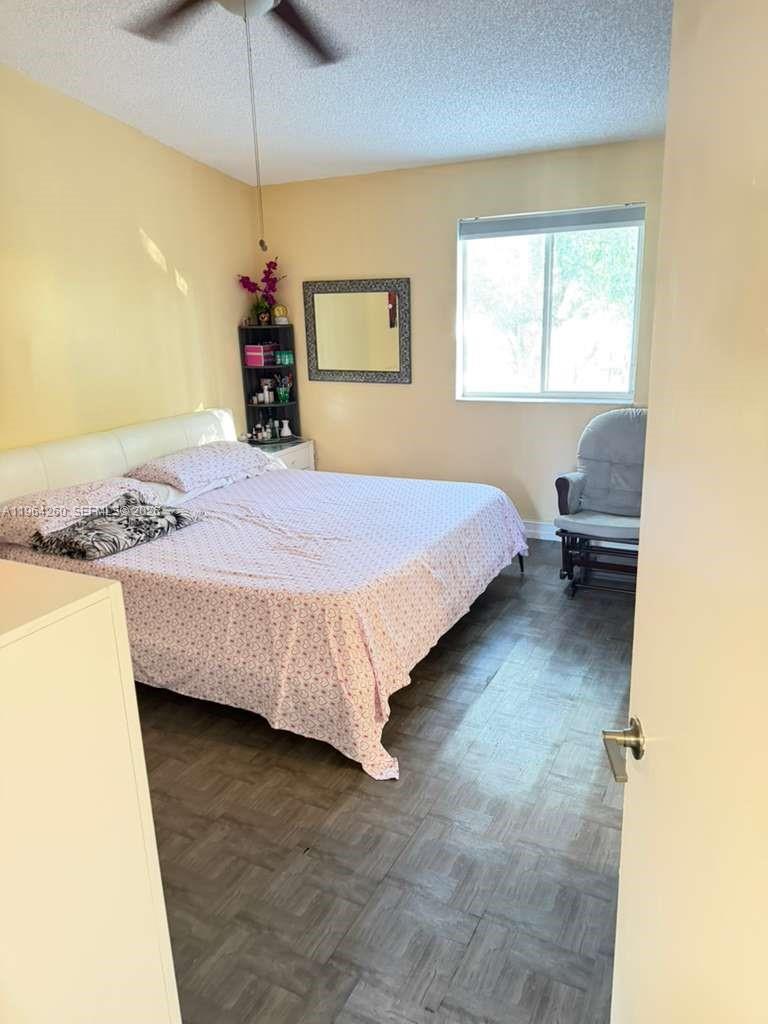 14012 Southwest 179th Street Miami, FL 33177 - Photo 17 of 17 a bedroom with a bed and window