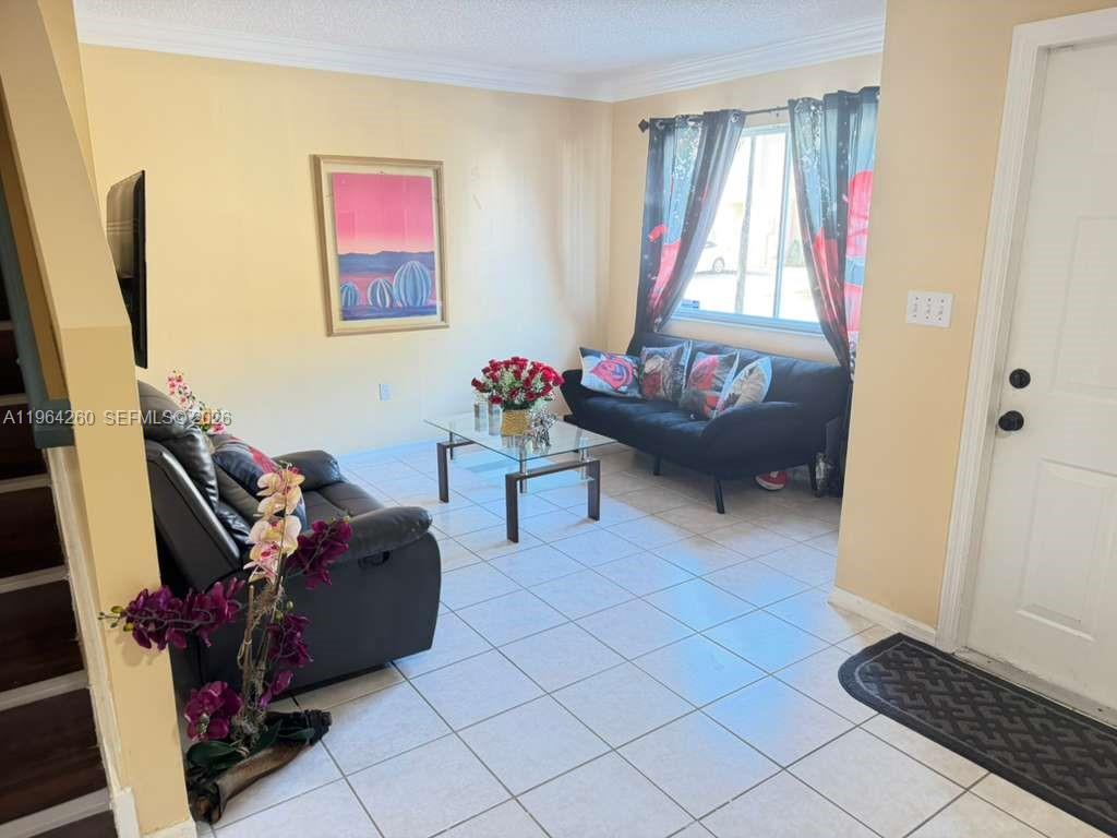14012 Southwest 179th Street Miami, FL 33177 - Photo 5 of 17 a living room with furniture and a window