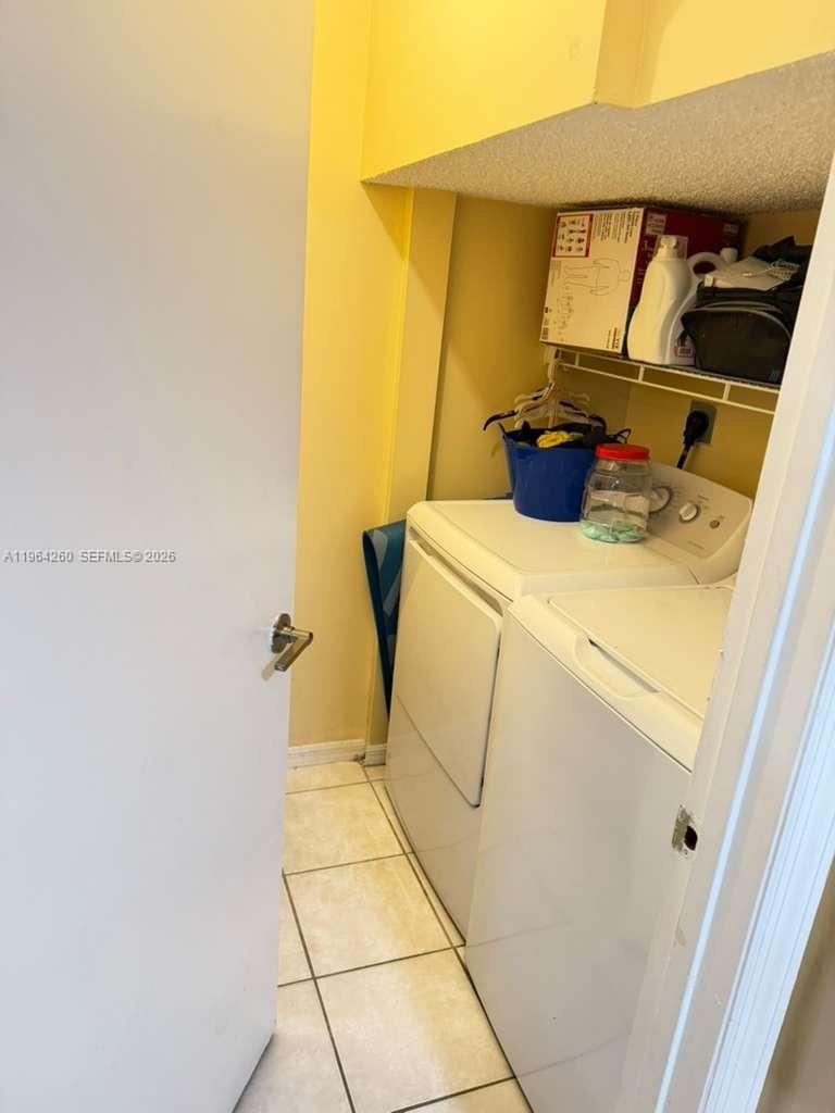 14012 Southwest 179th Street Miami, FL 33177 - Photo 9 of 17 a utility room with dryer and washer