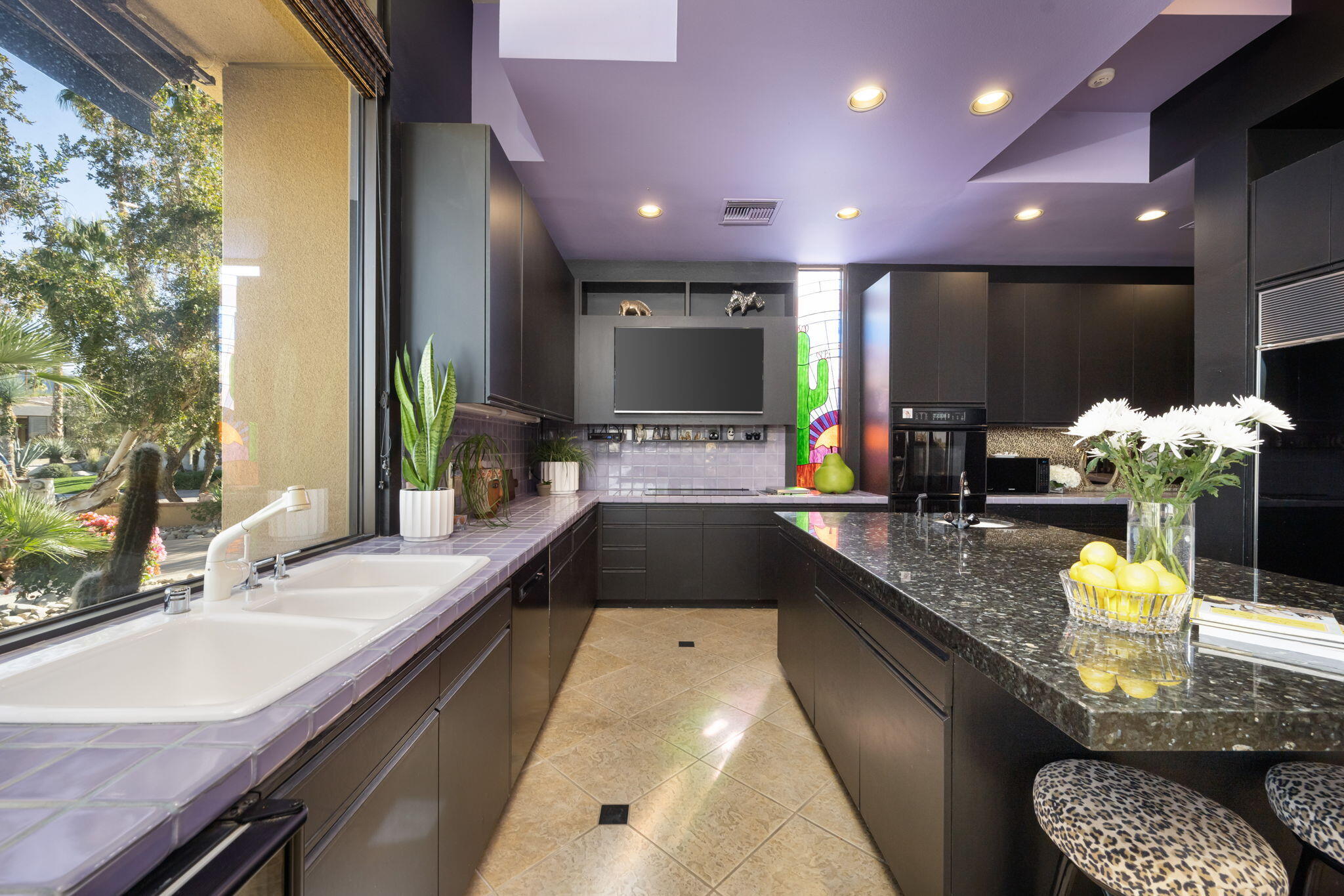 73380 Agave Lane Palm Desert, CA 92260 - Photo 23 of 81 a kitchen with kitchen island granite countertop a sink and a stove