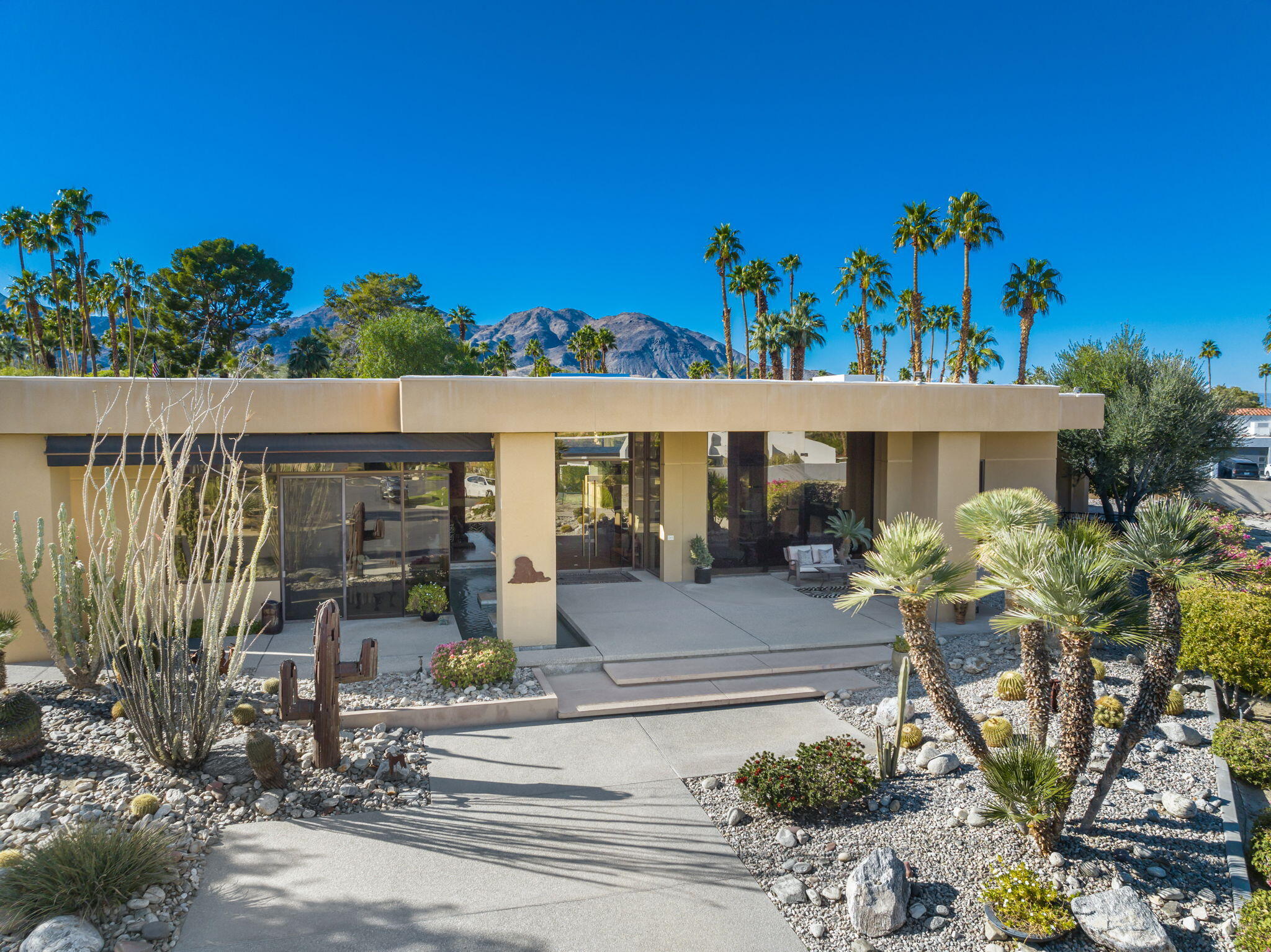 73380 Agave Lane Palm Desert, CA 92260 - Photo 3 of 81 a front view of a house with sitting area
